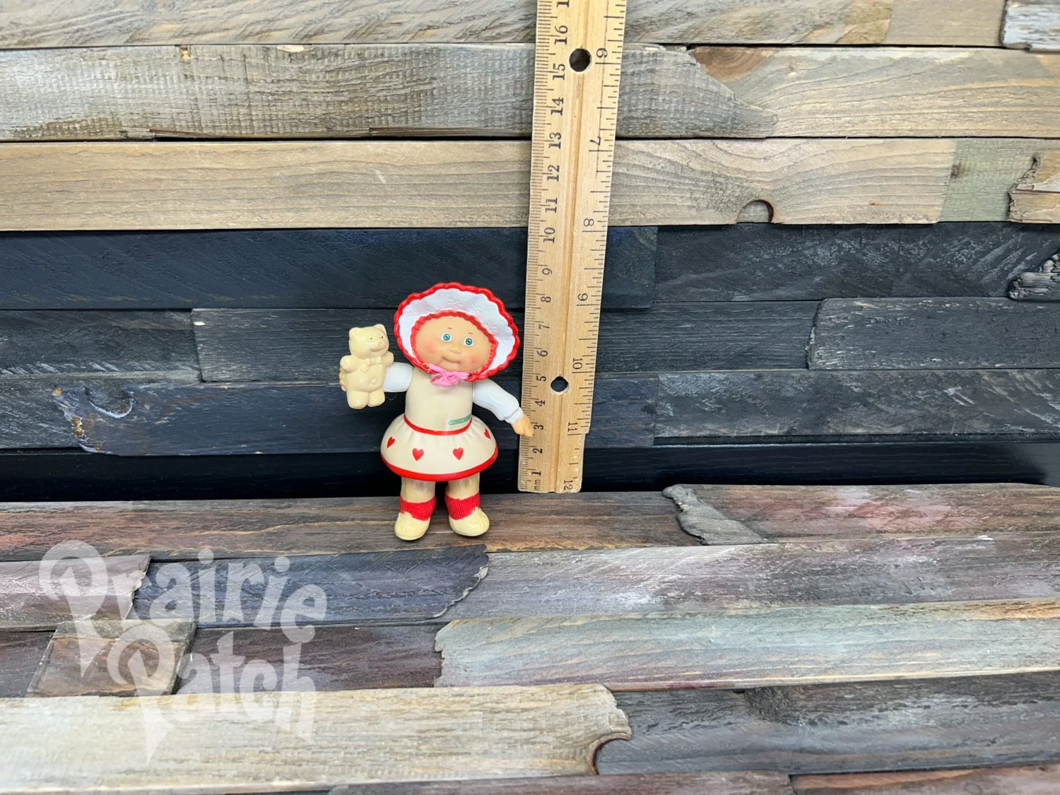 Figurine with teddy bear