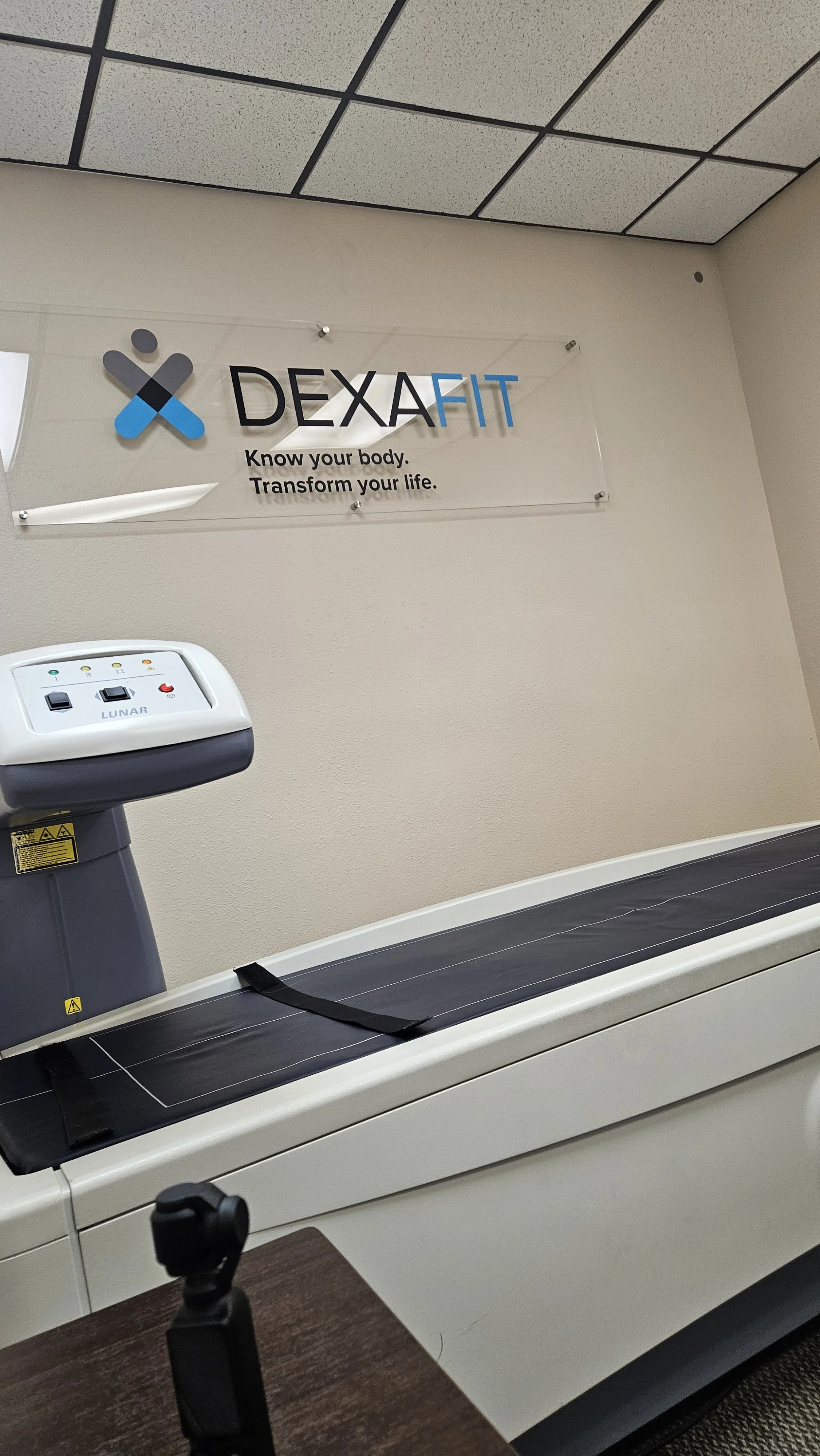 The DEXA scan table and scanner arm at a body composition clinic