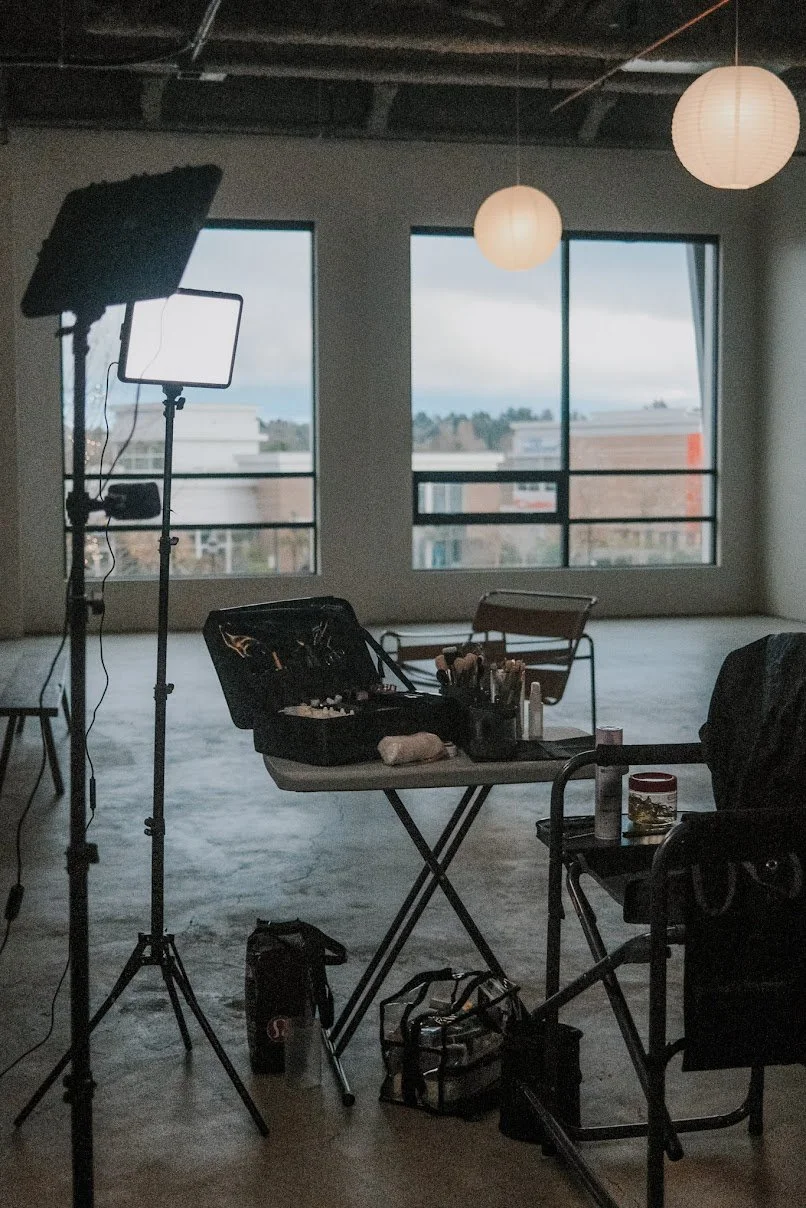 Empty room with makeup station and lighting equipment