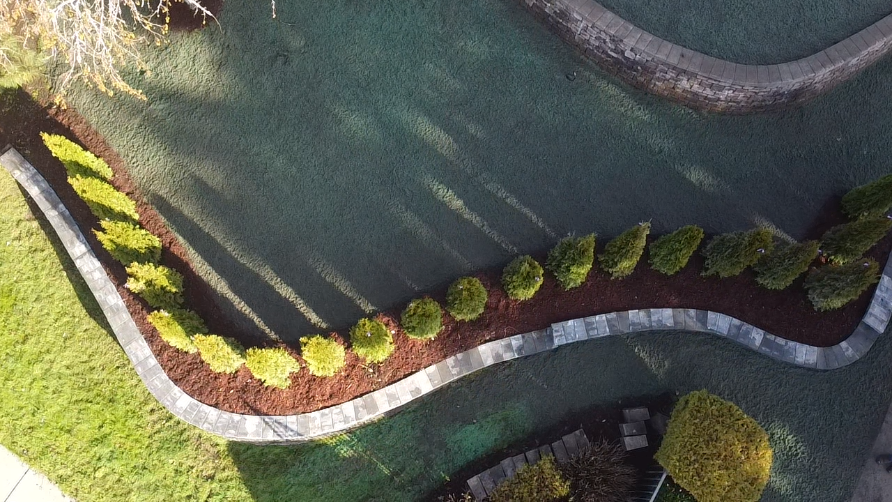 aerial view of custom build retaining wall and hydroseed