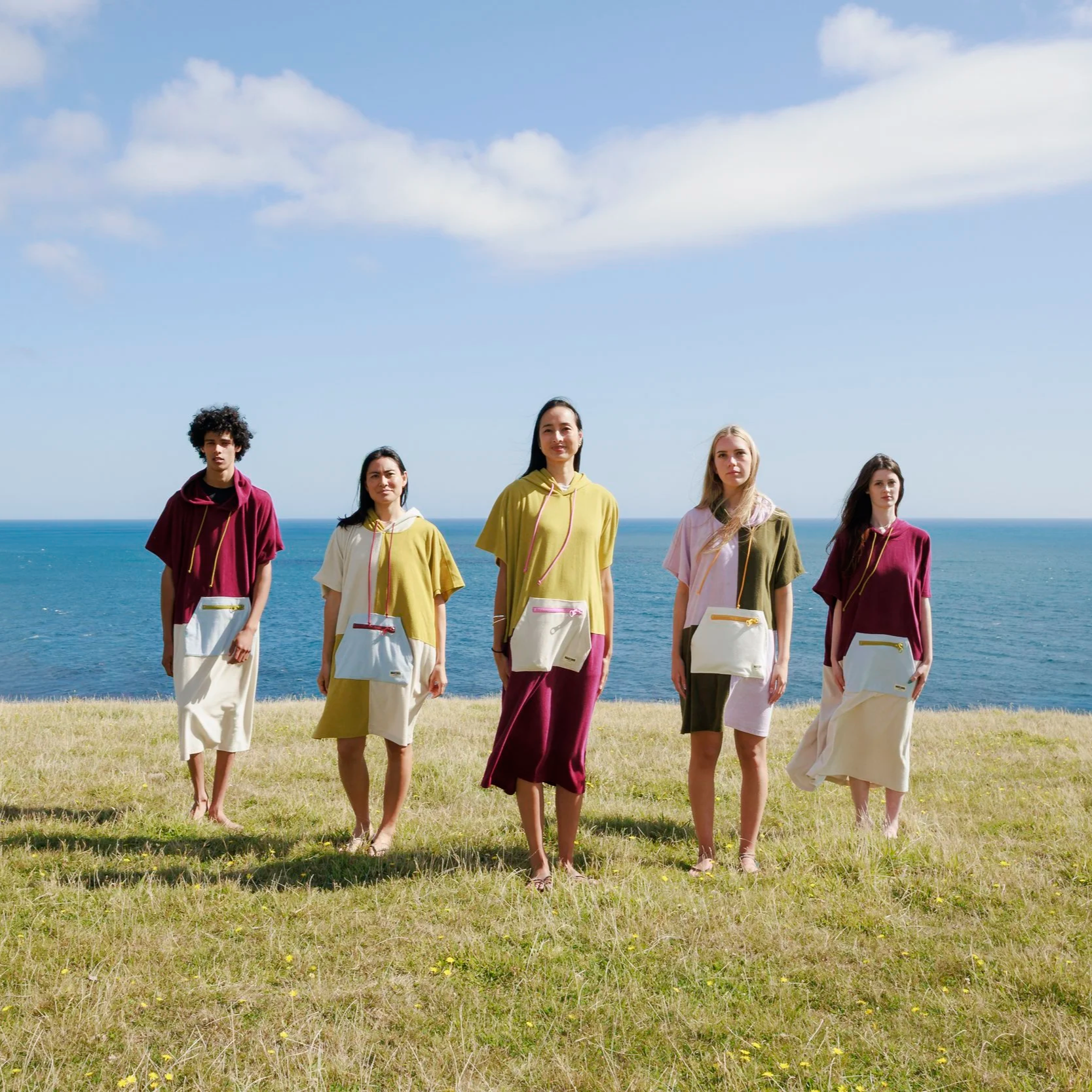 5 friends wearing WaveyDrip towel ponchos