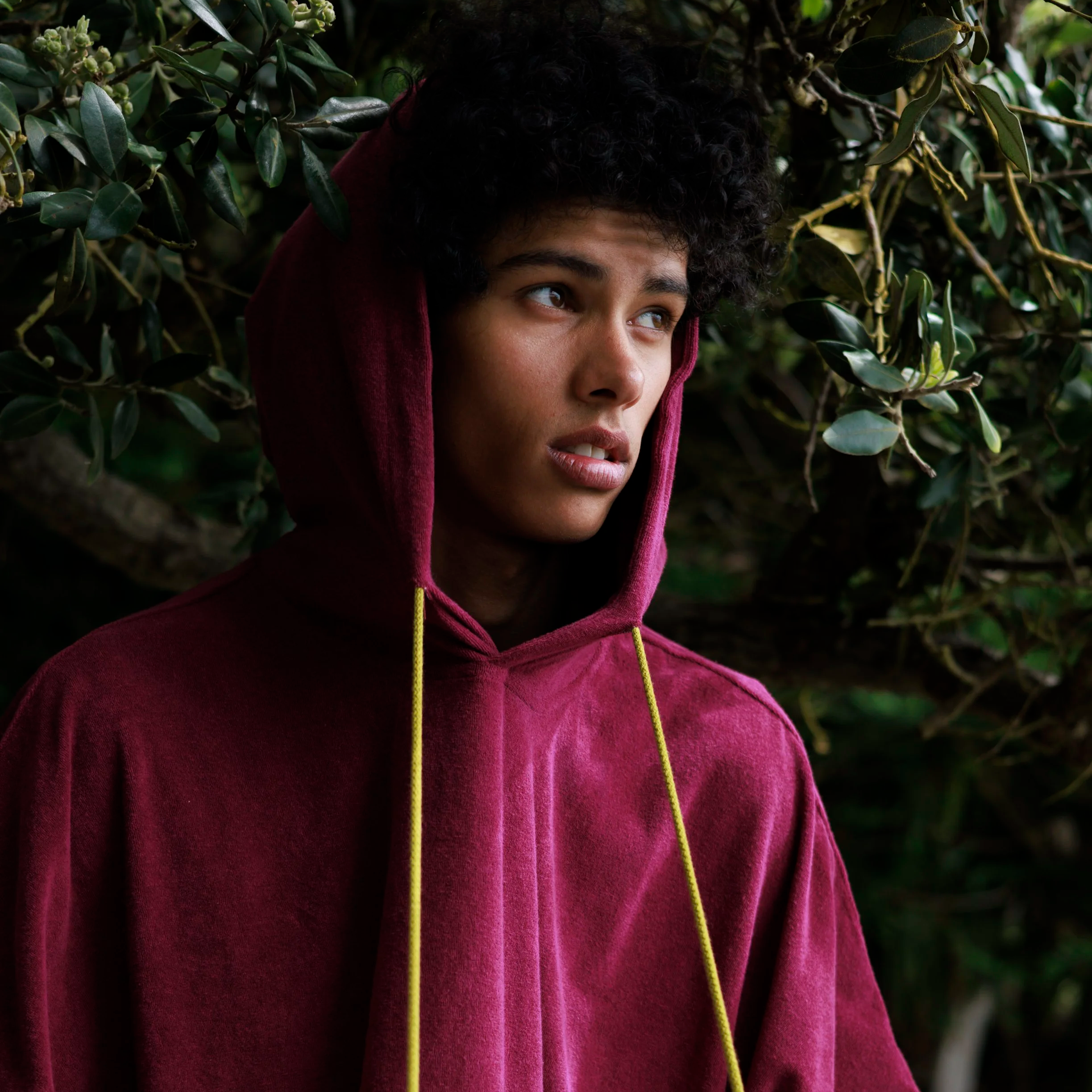 Model wearing the "Drifter" WaveyDrip towel poncho