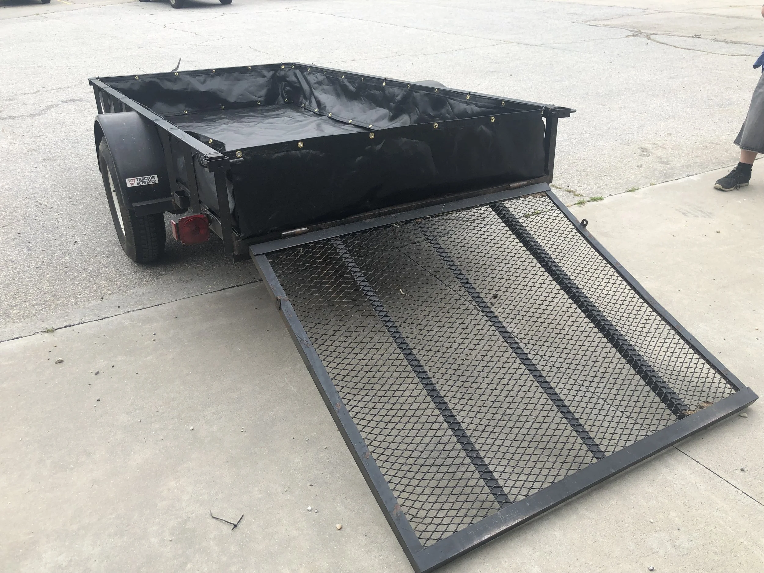 A fabric containment system for A utility trailer to help close up the side of a trailer