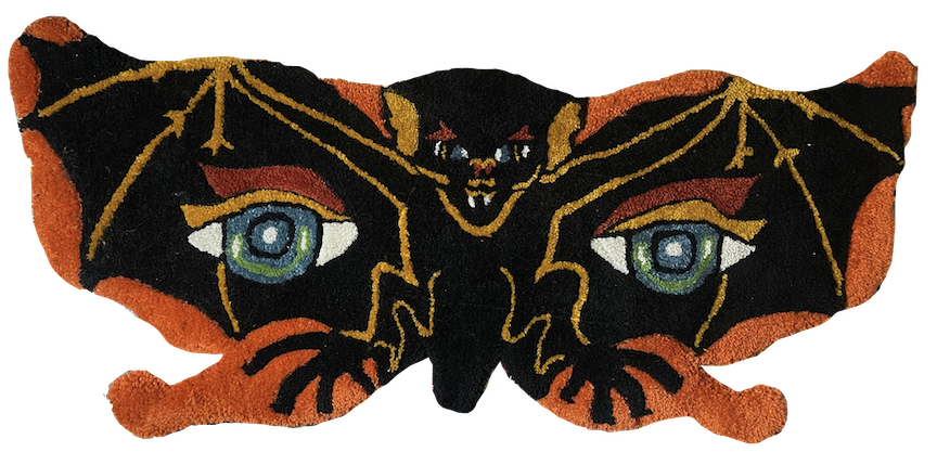 Vintage bat mask with eyes on its wings, featuring orange, black, and yellow colors.