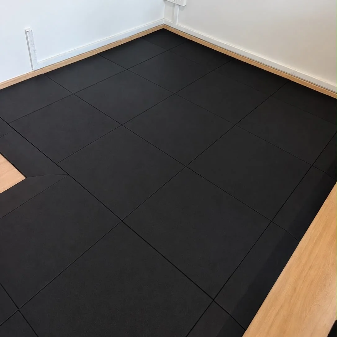 For the this project, the client requested rubber flooring only within a specific section of the room. The area was measured and custom fitted on site, with clean perimeter cuts and termination slopes to create a defined training space while retainin