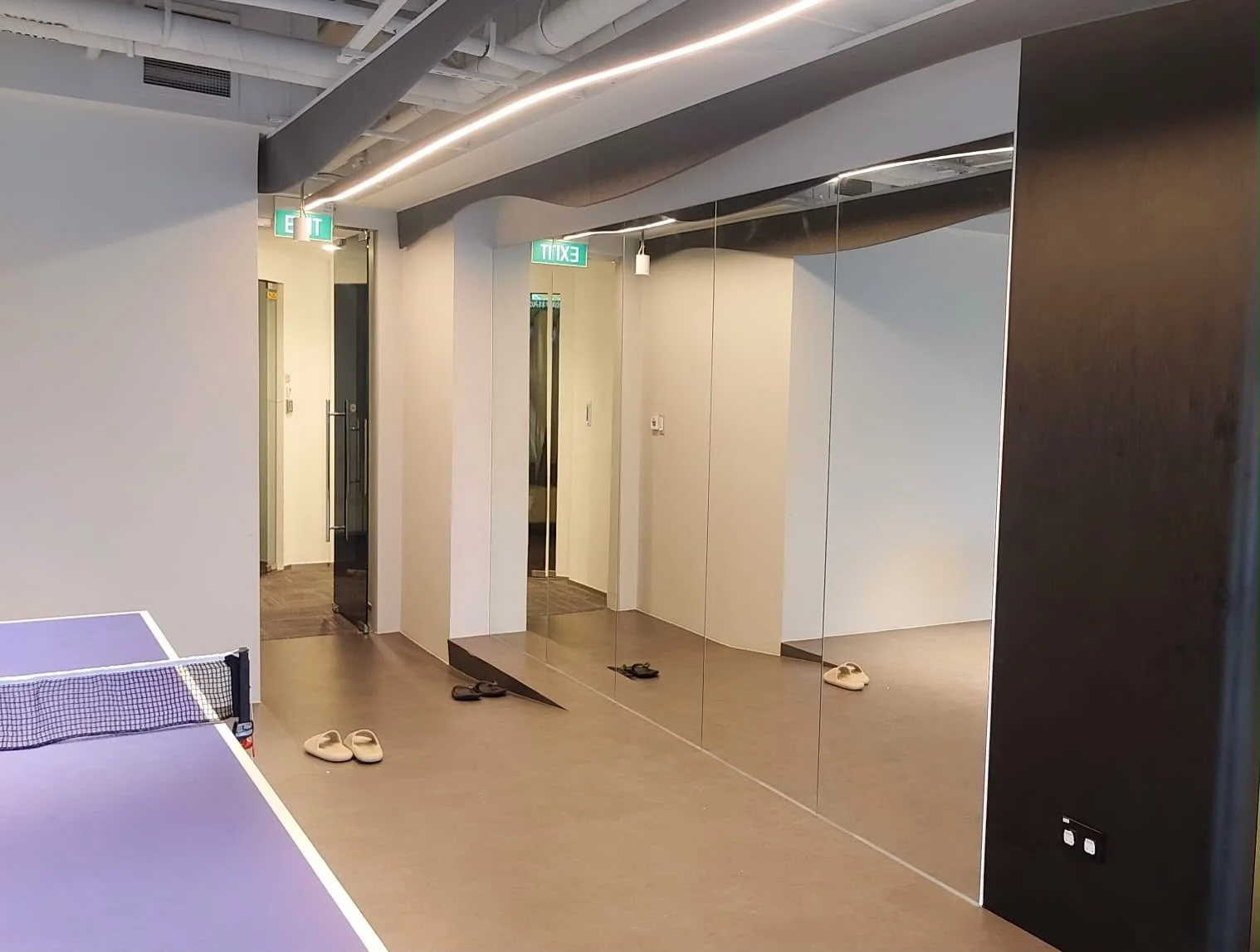 Full-length mirror installation for this office recreation area. 🪞 A simple addition to open up the space and make it more functional for workouts and activities 💪✨