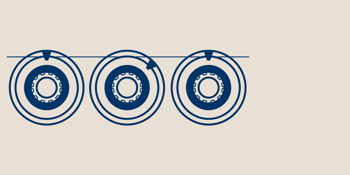 Three navy dials on a beige field under a thin index line, the middle dial turned out of line