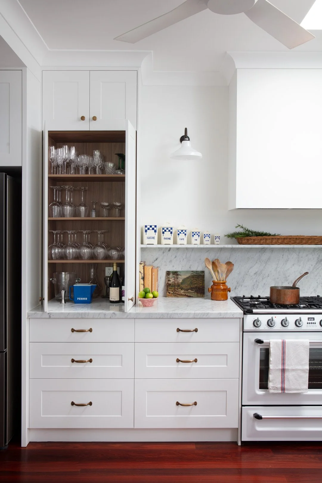 Detailed cabinetry and practical storage solutions in this French inspired kitchen renovation for a French Australian family