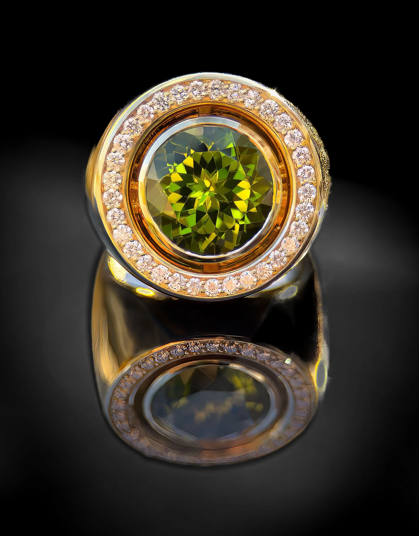 Close-up of a gold ring with a central green gemstone and a halo of small diamonds, reflecting on a black surface.
