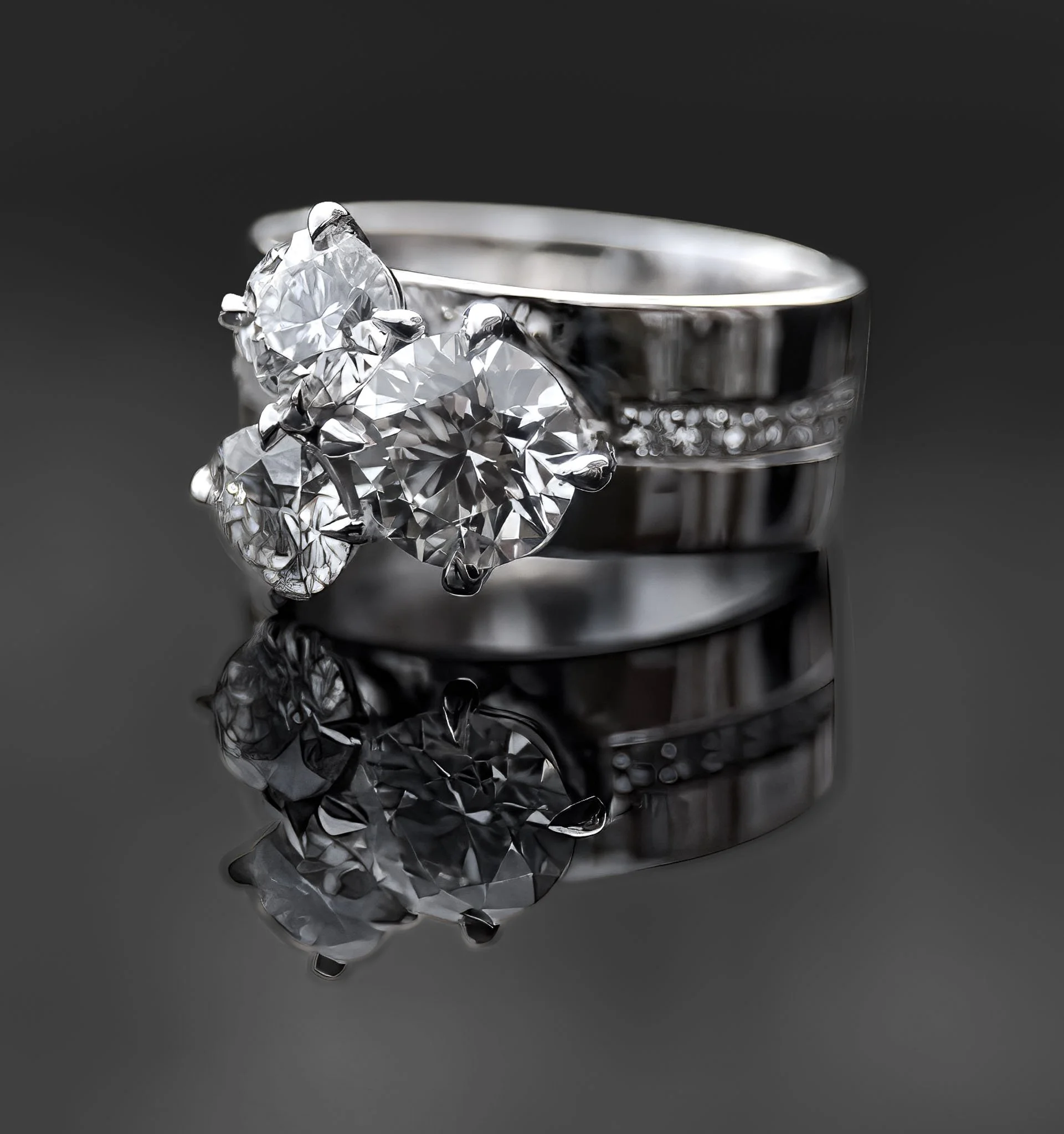 Close-up of a diamond engagement ring on a reflective black surface, with a large diamond and smaller diamonds on the band.