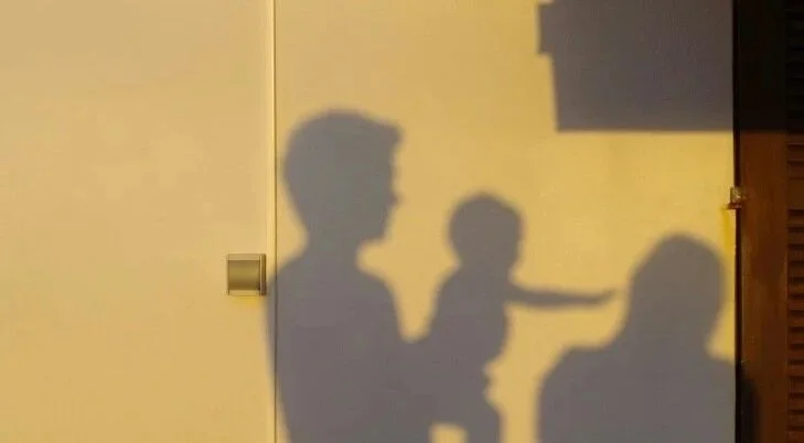 Parents holding baby