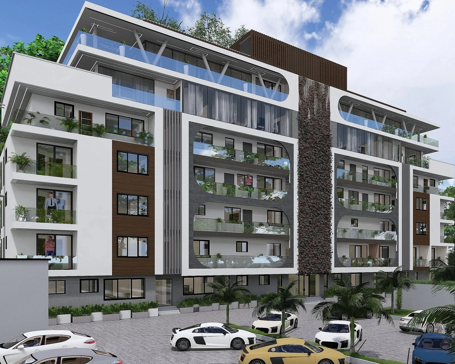 Modern multi-story apartment building with balconies, large glass windows, and contemporary architectural design. Several cars are parked in front, with a landscaped area and palm trees at the entrance.