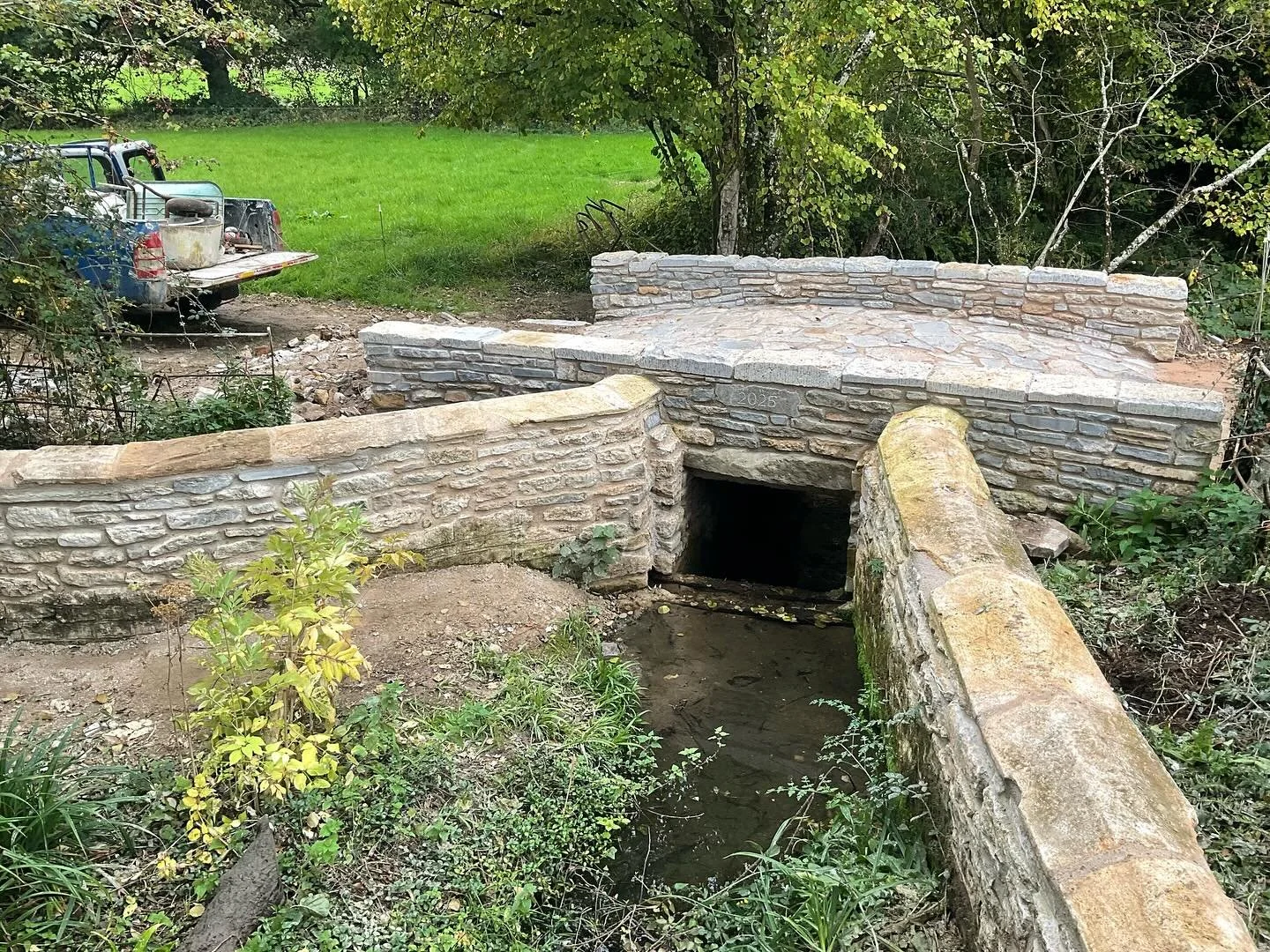 A great project from start to finish, redesigning a bridge and using reclaimed stones from around the farm.
