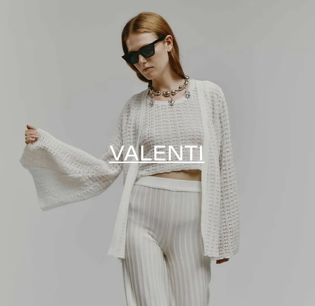 Fashion model in white knitted outfit, wearing sunglasses, text 'VALENTI' overlay