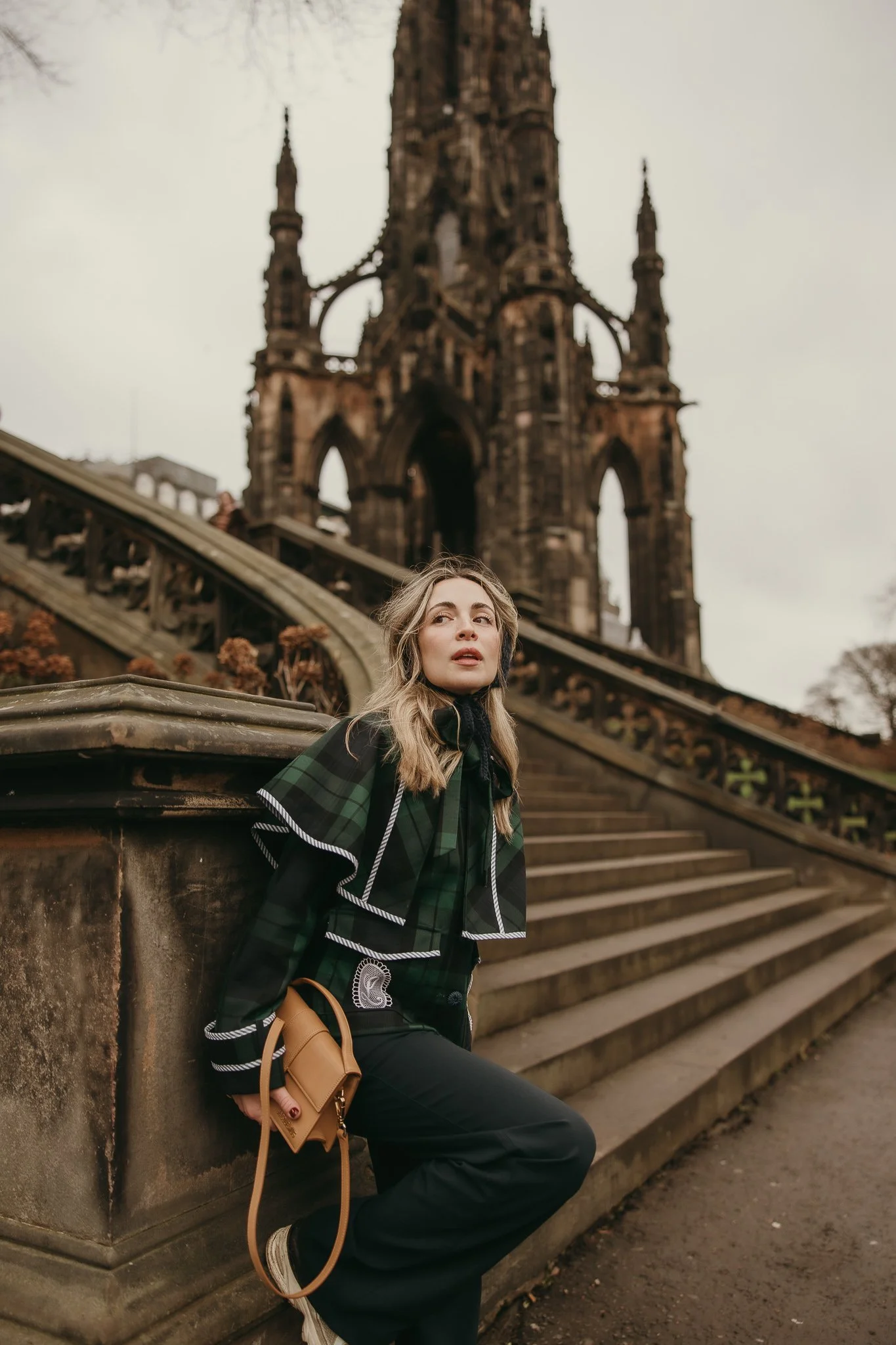 Girl walking in Edinburgh at sunrise during a cinematic portrait session.