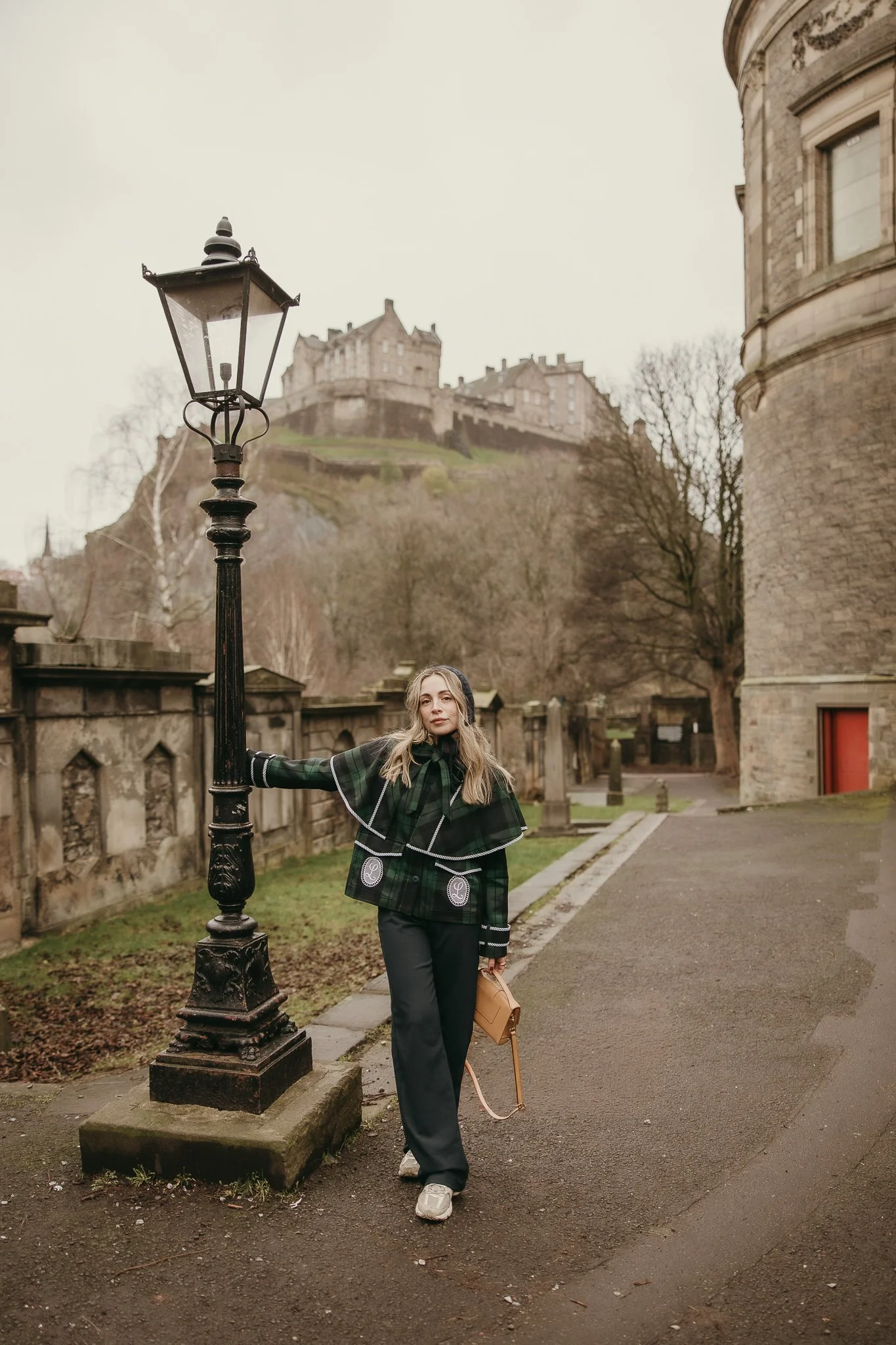 Solo traveler wandering through the charming streets of Edinburgh, Scotland.