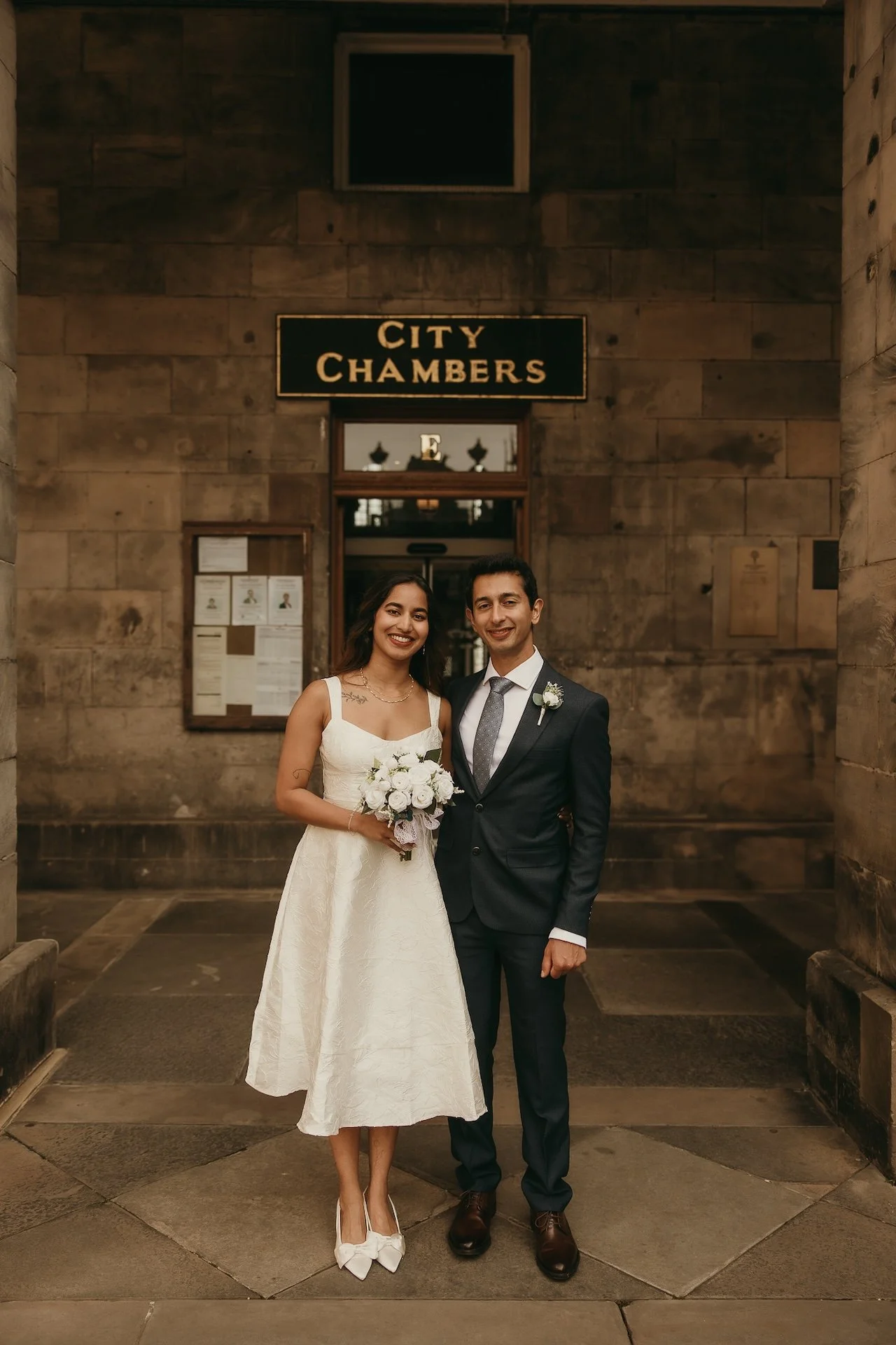Bride and groom enjoying a quiet moment away from guests at their Edinburgh wedding