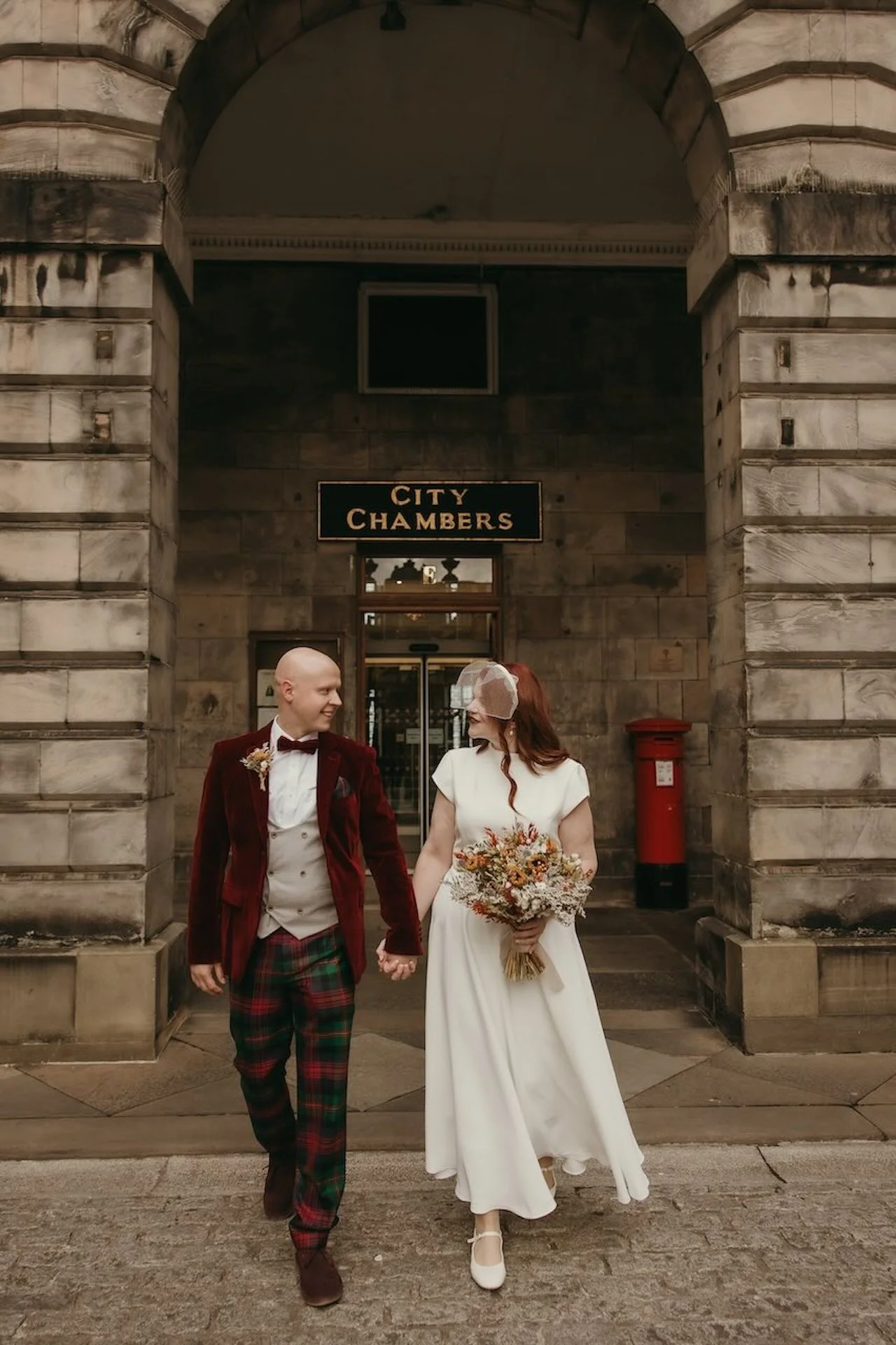 Documentary-style wedding photography capturing bride and groom in Edinburgh