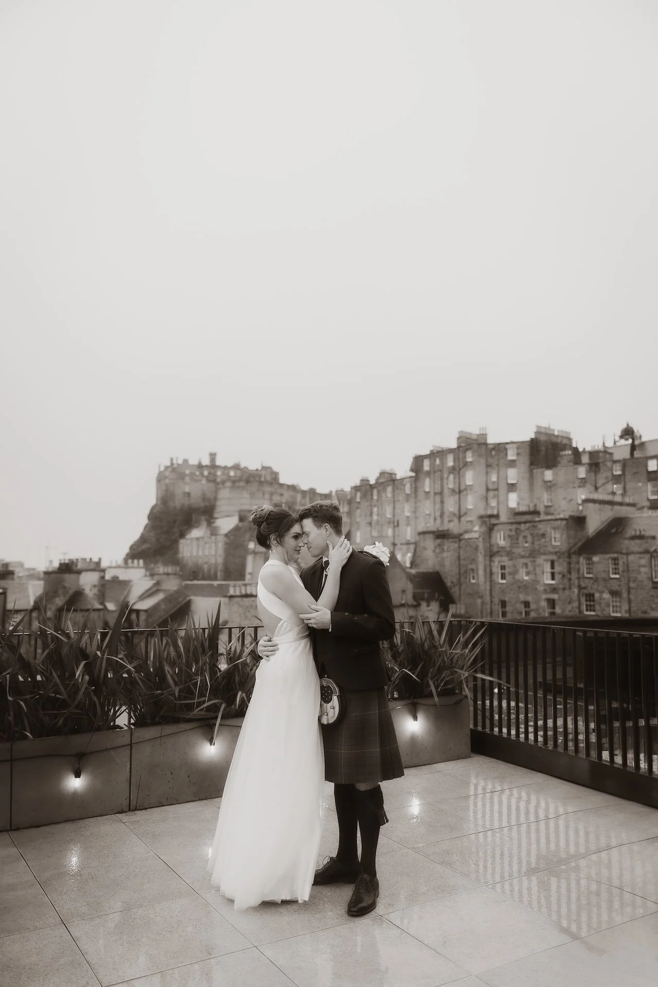 Bride and groom embracing during a heartfelt wedding moment in Edinburgh