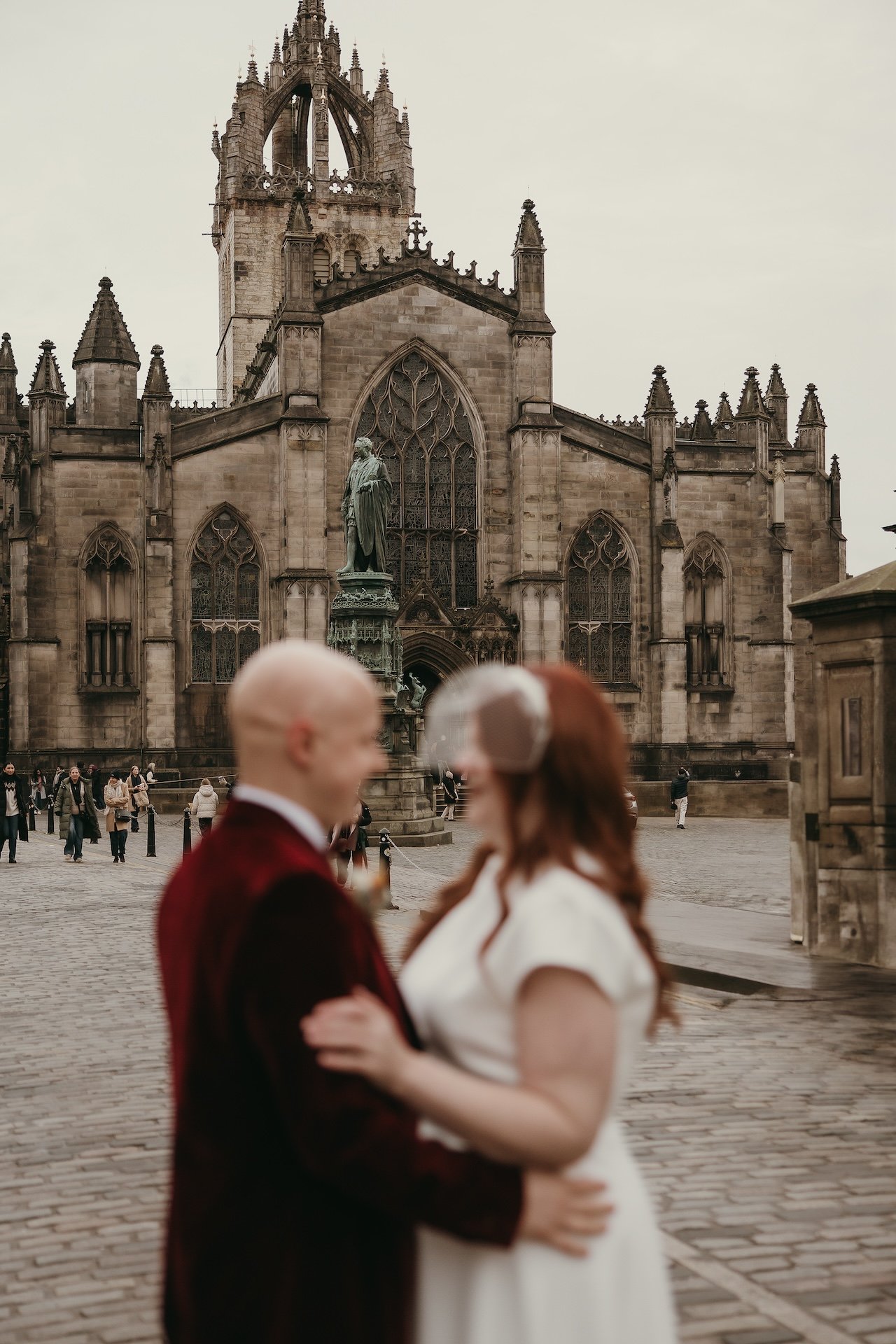 Couple embracing during a romantic photography session in Edinburgh
