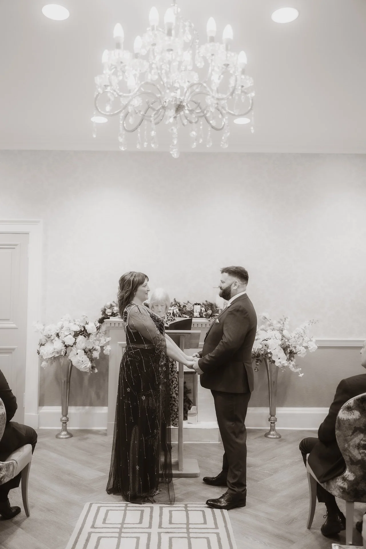 Bride and groom holding hands during their wedding celebration in Edinburgh