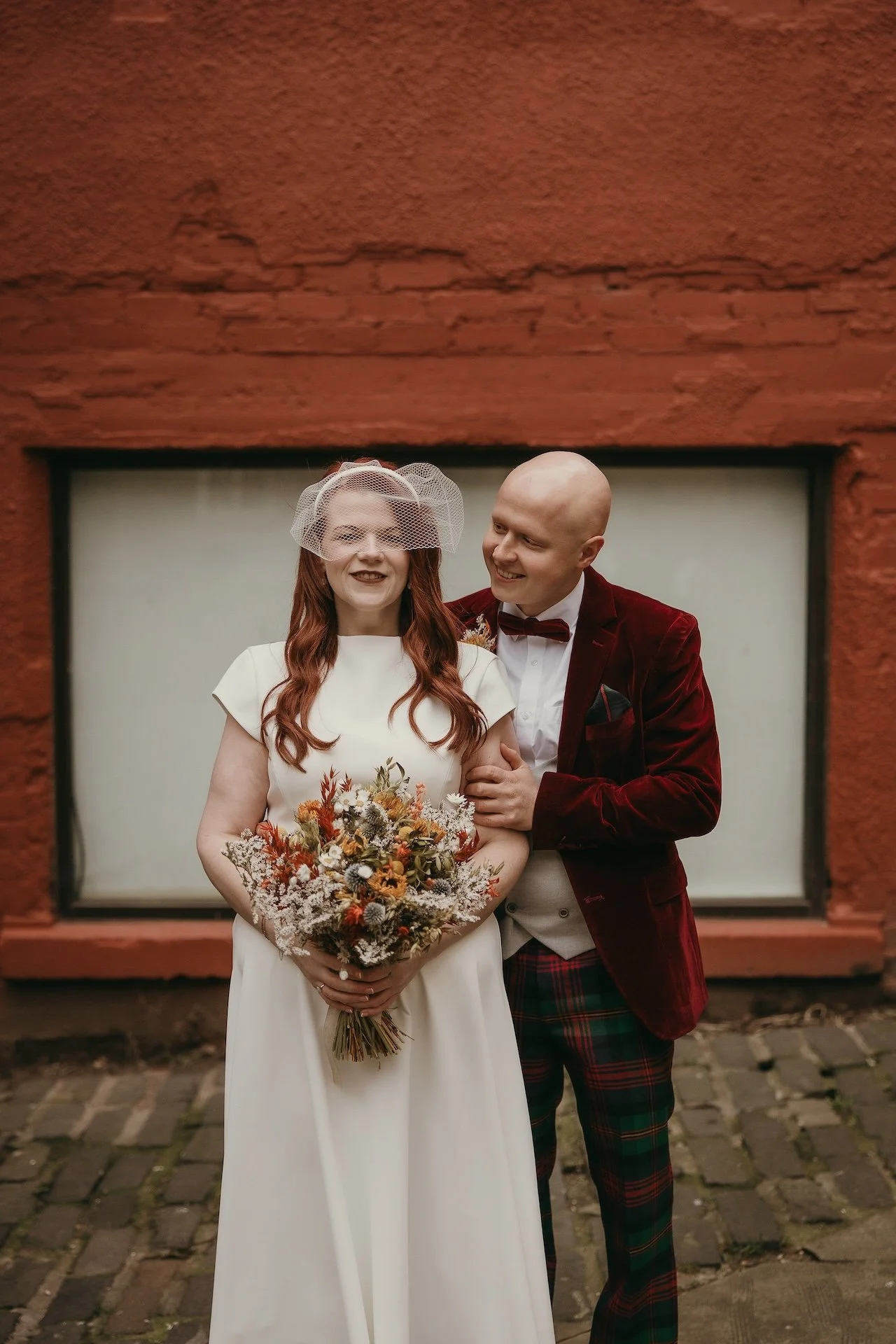 Emotional wedding moment between bride and groom captured in Edinburgh