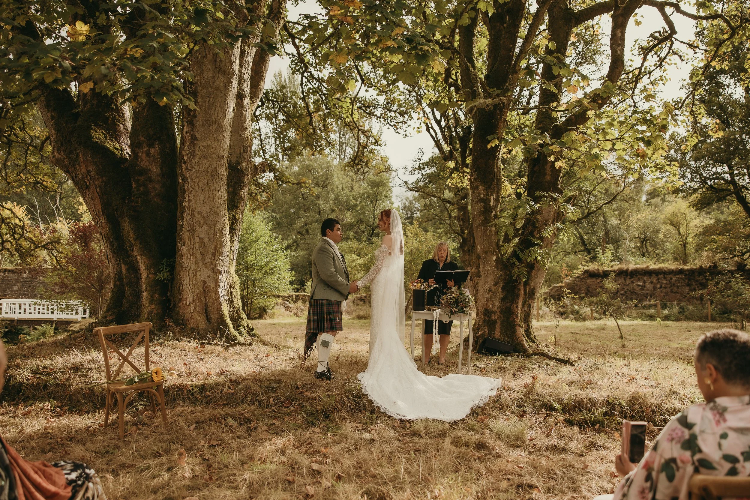 Outdoor wedding ceremony at Penicuik Estate with guests