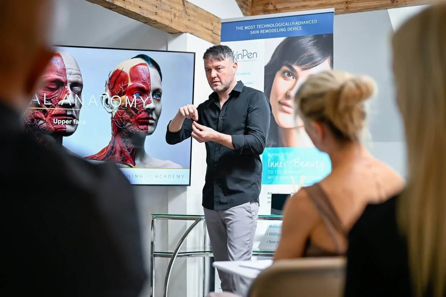 Trainer presenting facial anatomy during a botox course for dentists doctors and nurses in Manchester UK