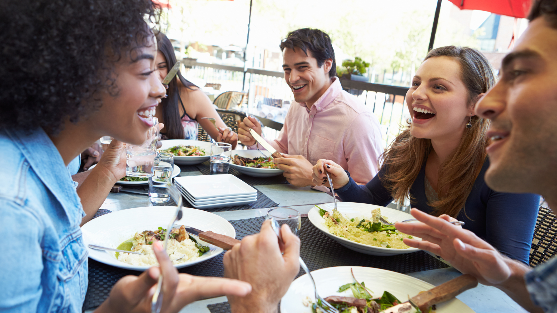 group of friends eat in restaurant