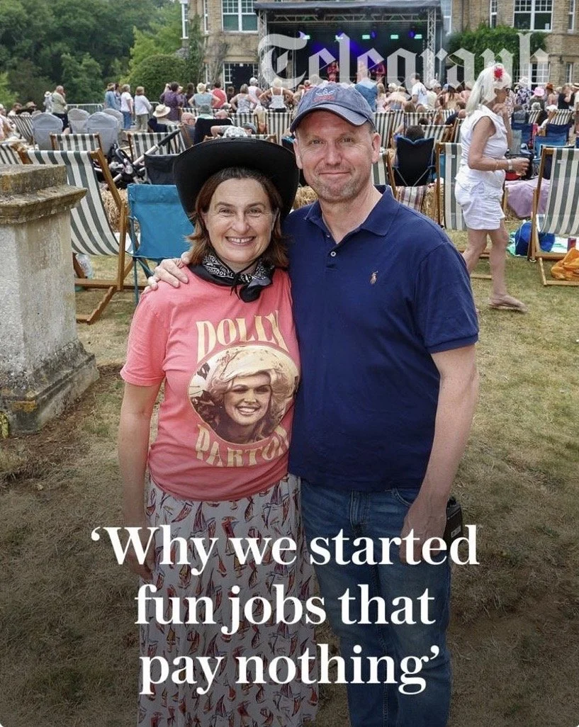 Co-founders of Tribute Music Fest smiling together outdoors at the festival grounds, featured in a Daily Telegraph newspaper article.
