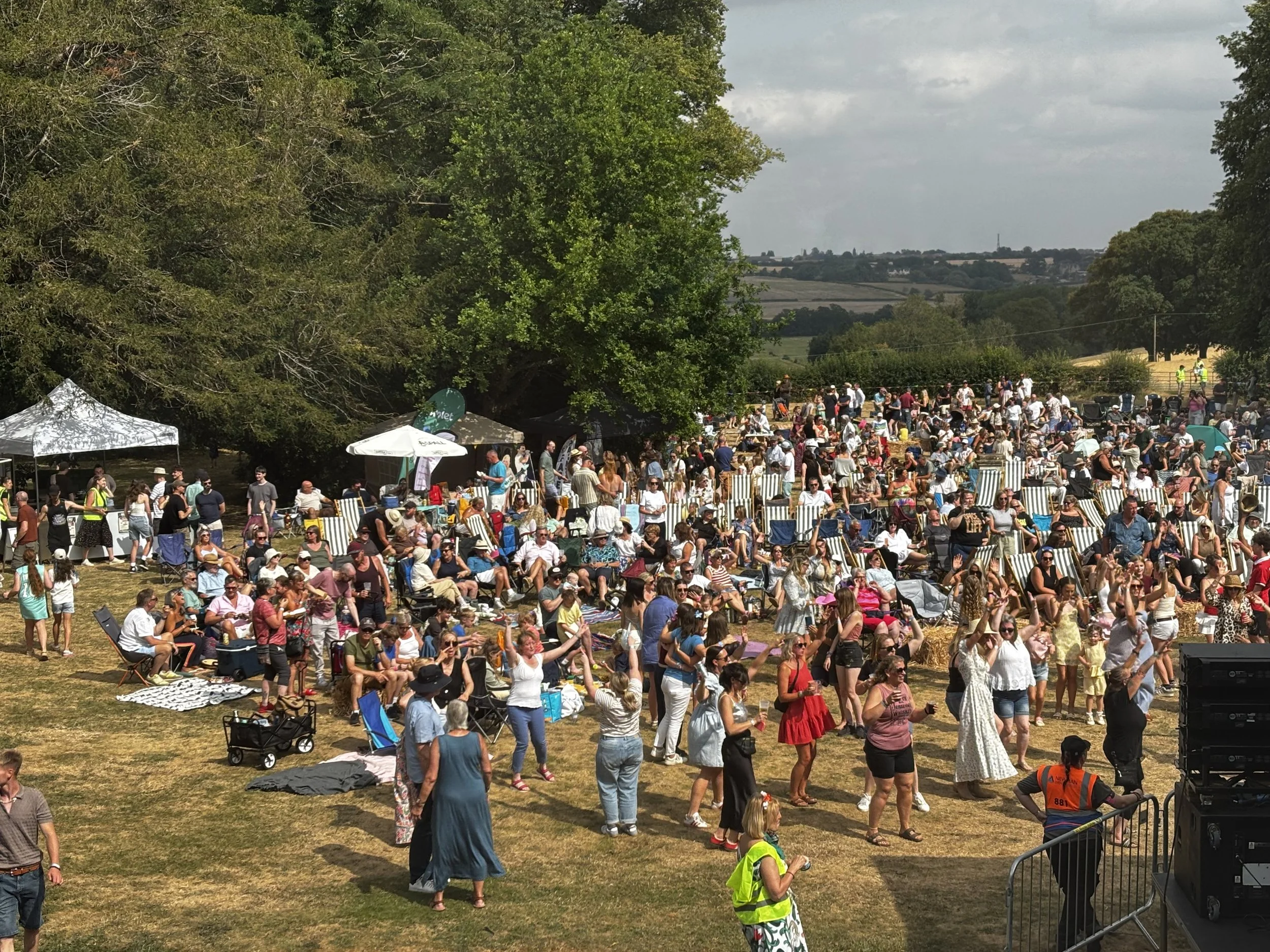 Crowd enjoying the music and sunshine at Tribute Music Fest '26