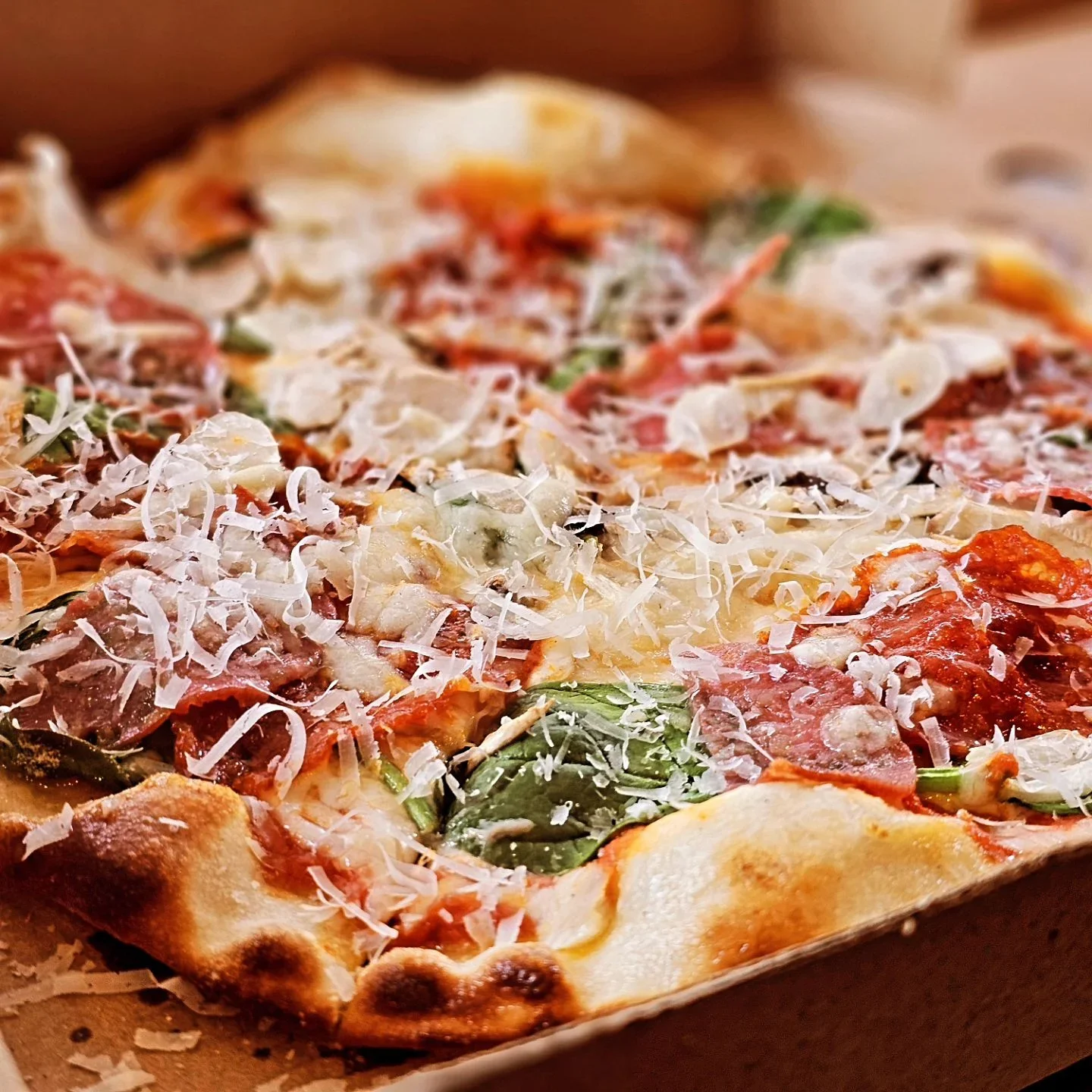 Delicious stone baked pizza served in a street food village at tribute music festival