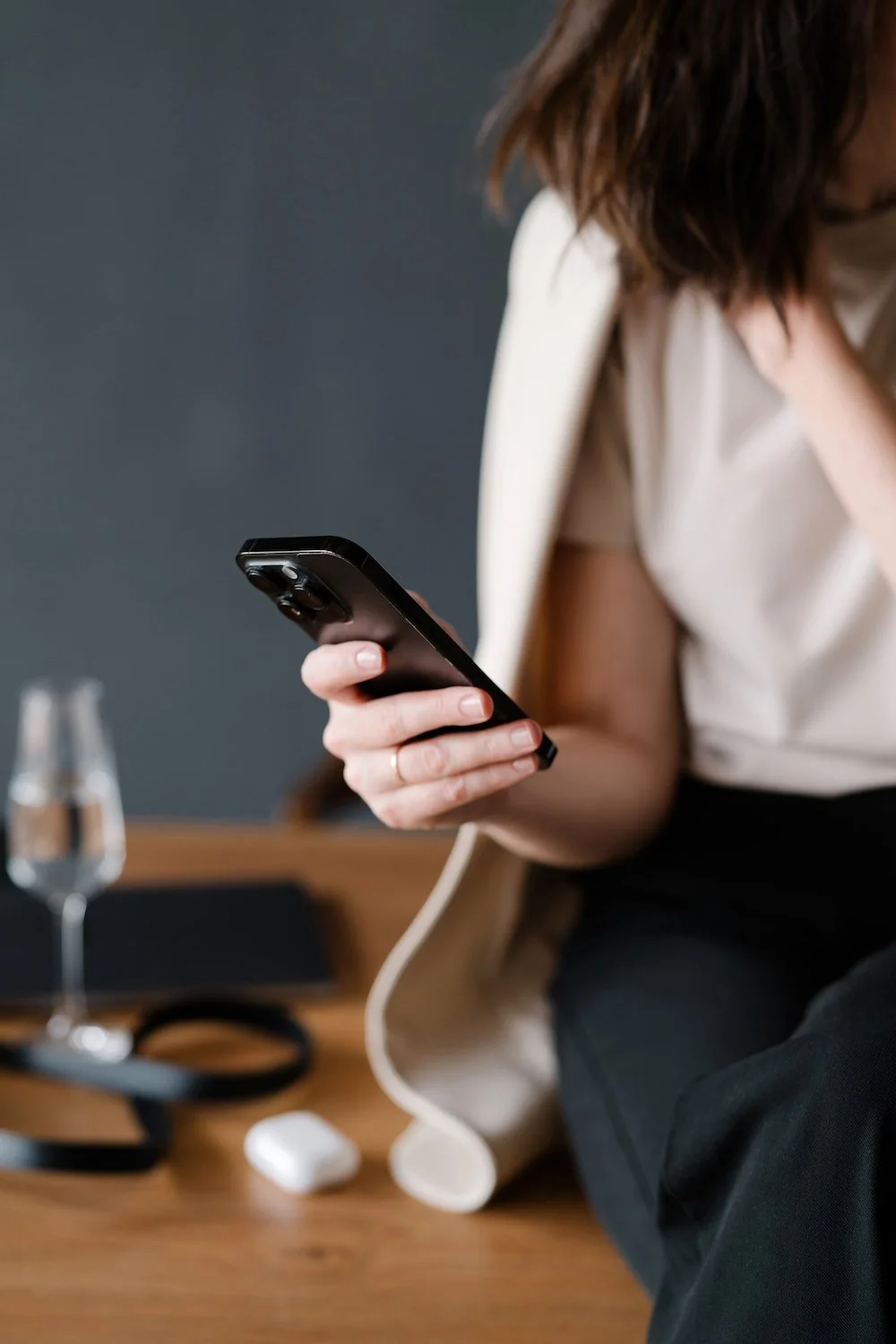 woman holding phone in hand