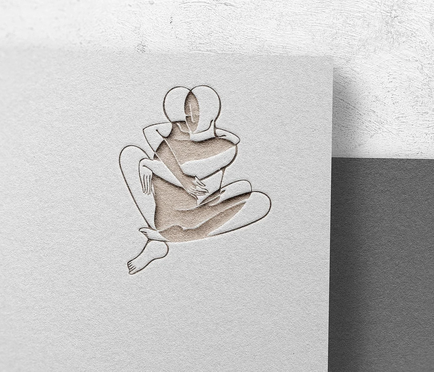 Illustration minimaliste de deux silhouettes s'enlaçant, découpées dans du papier.