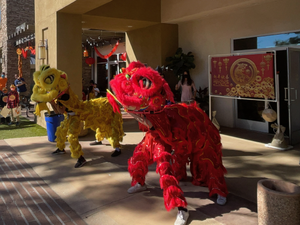 red-and-yellow-costumes-in-front-of-a-building.png