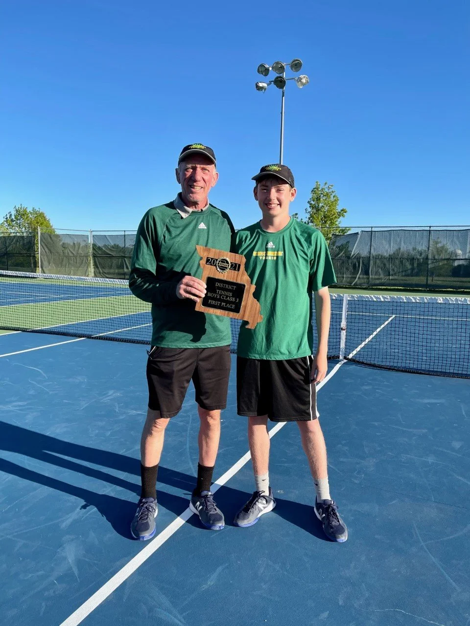 Ben & Coach District Champs.jpeg