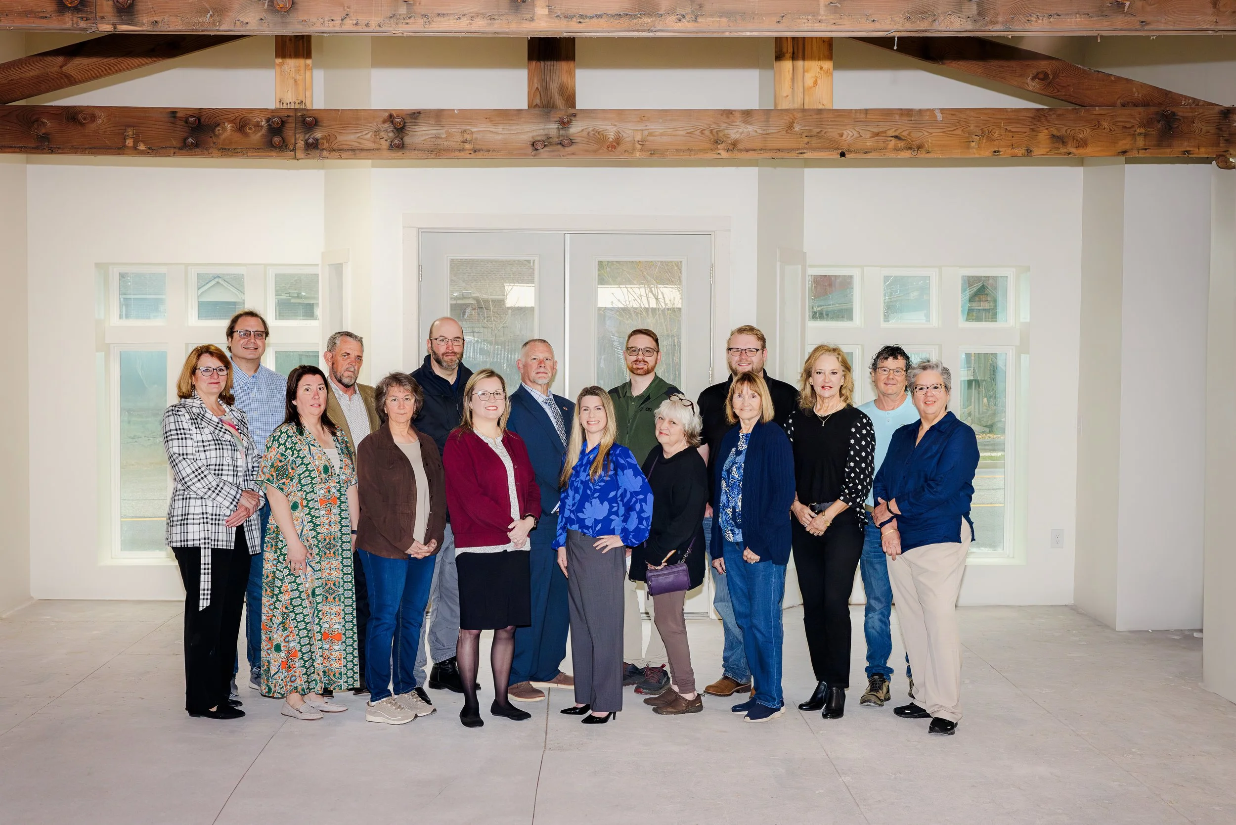 Group photo of Paris Business Center donors and Hiawassee Development Authority leadership inside newly renovated building photographed by K Boyer Real Estate Media