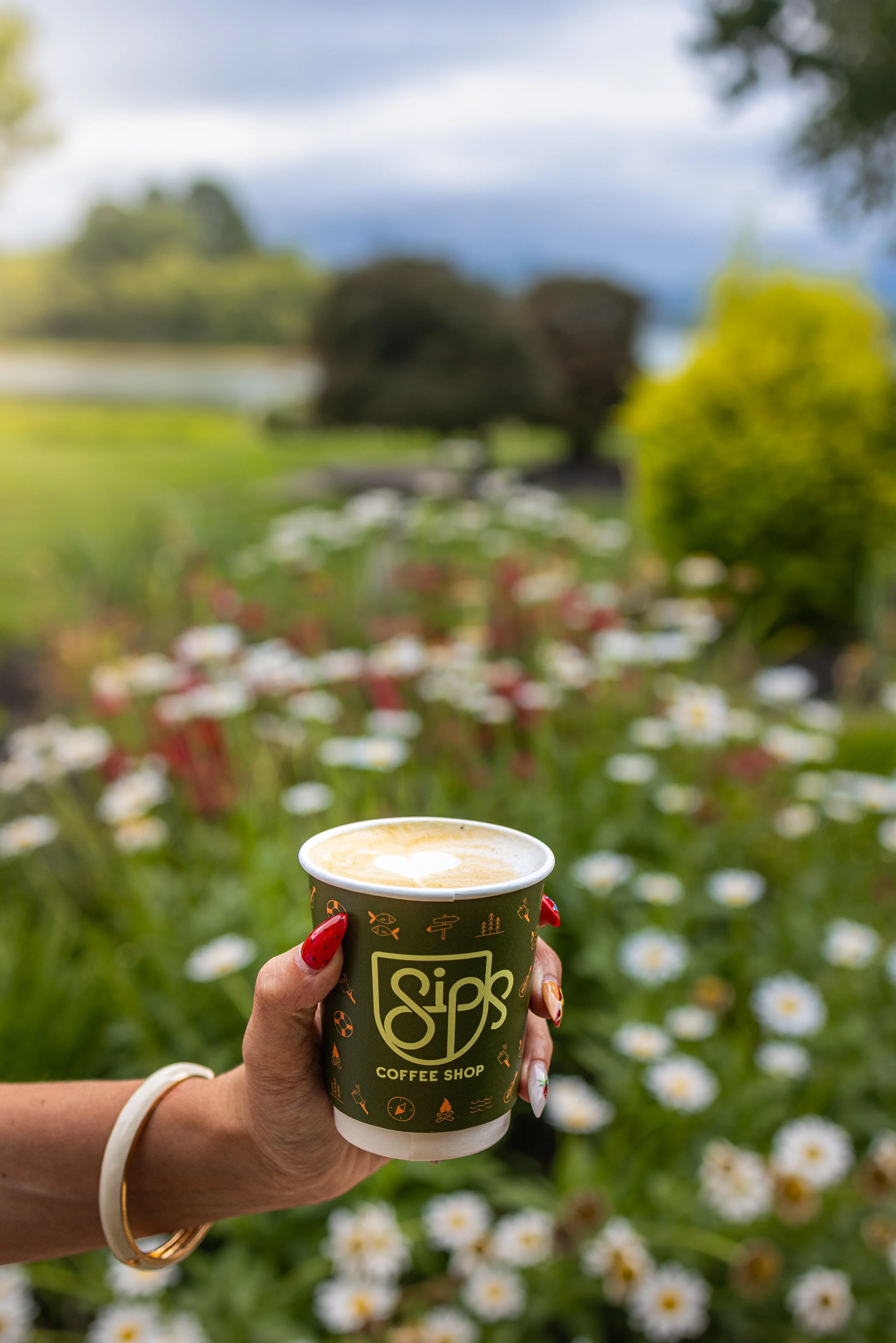 Sips coffee cup