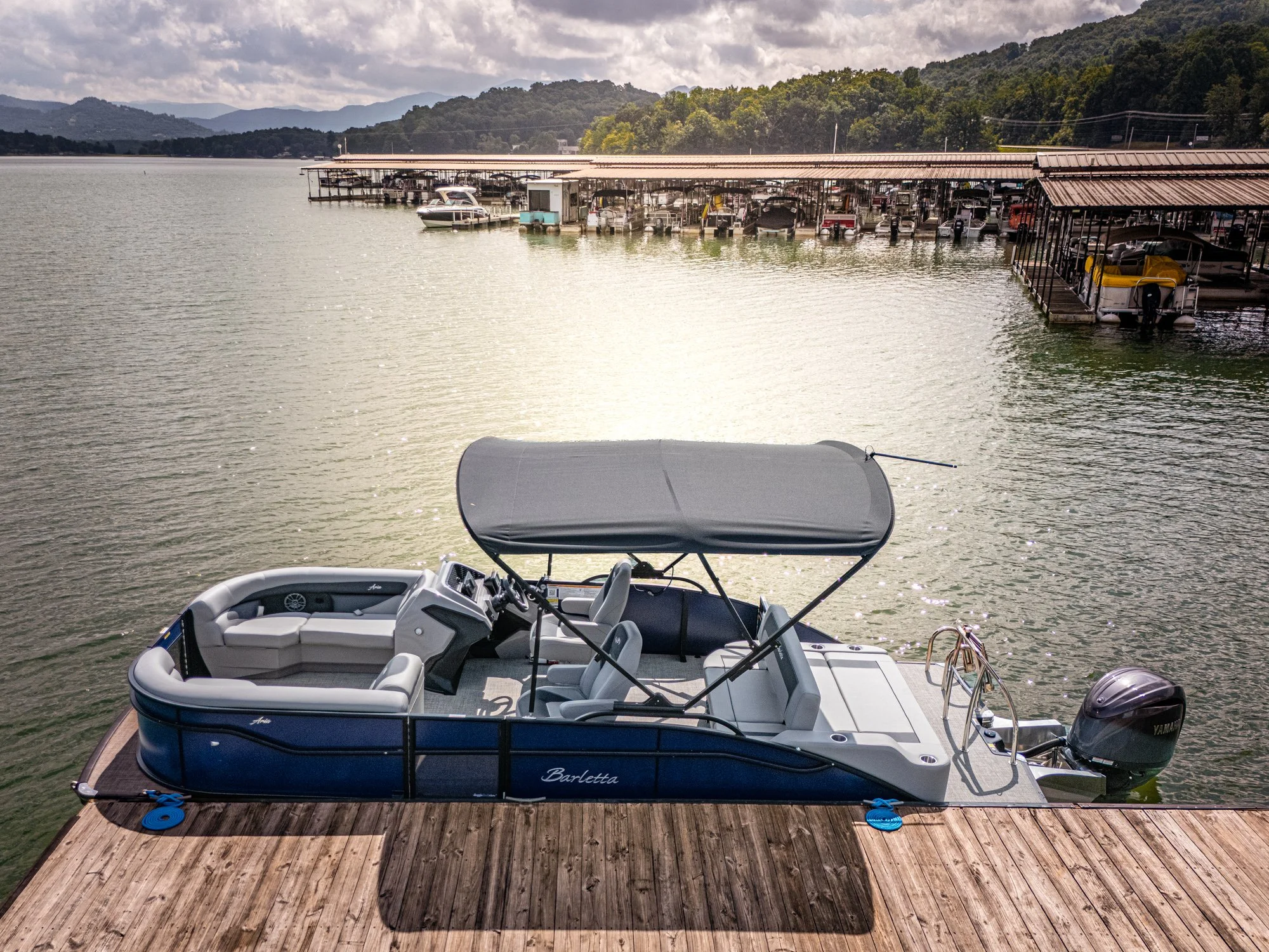 Pontoon boat sitting on the dock in the water
