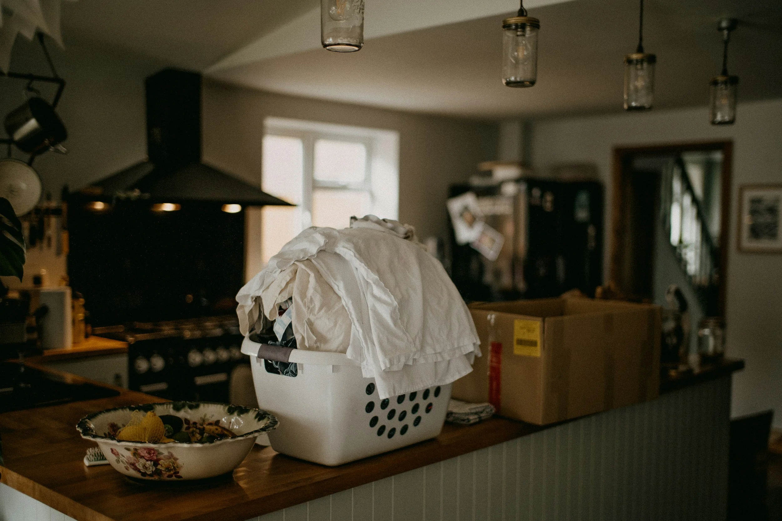 Pile of laundry and chores on a counter