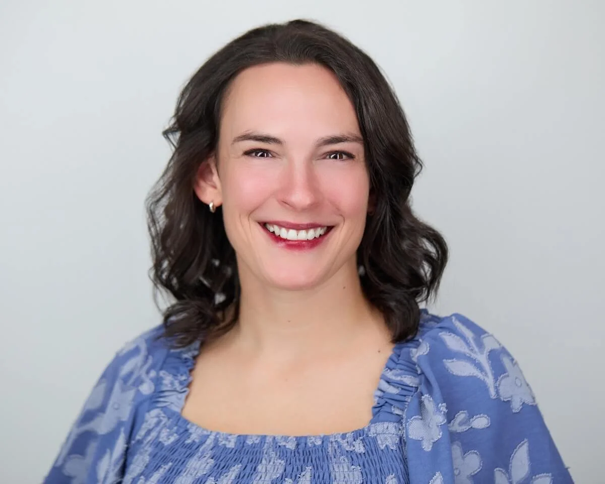 a professional headshot of therapist Bridget Caragher, she has a welcoming smile and looks directly into the camera