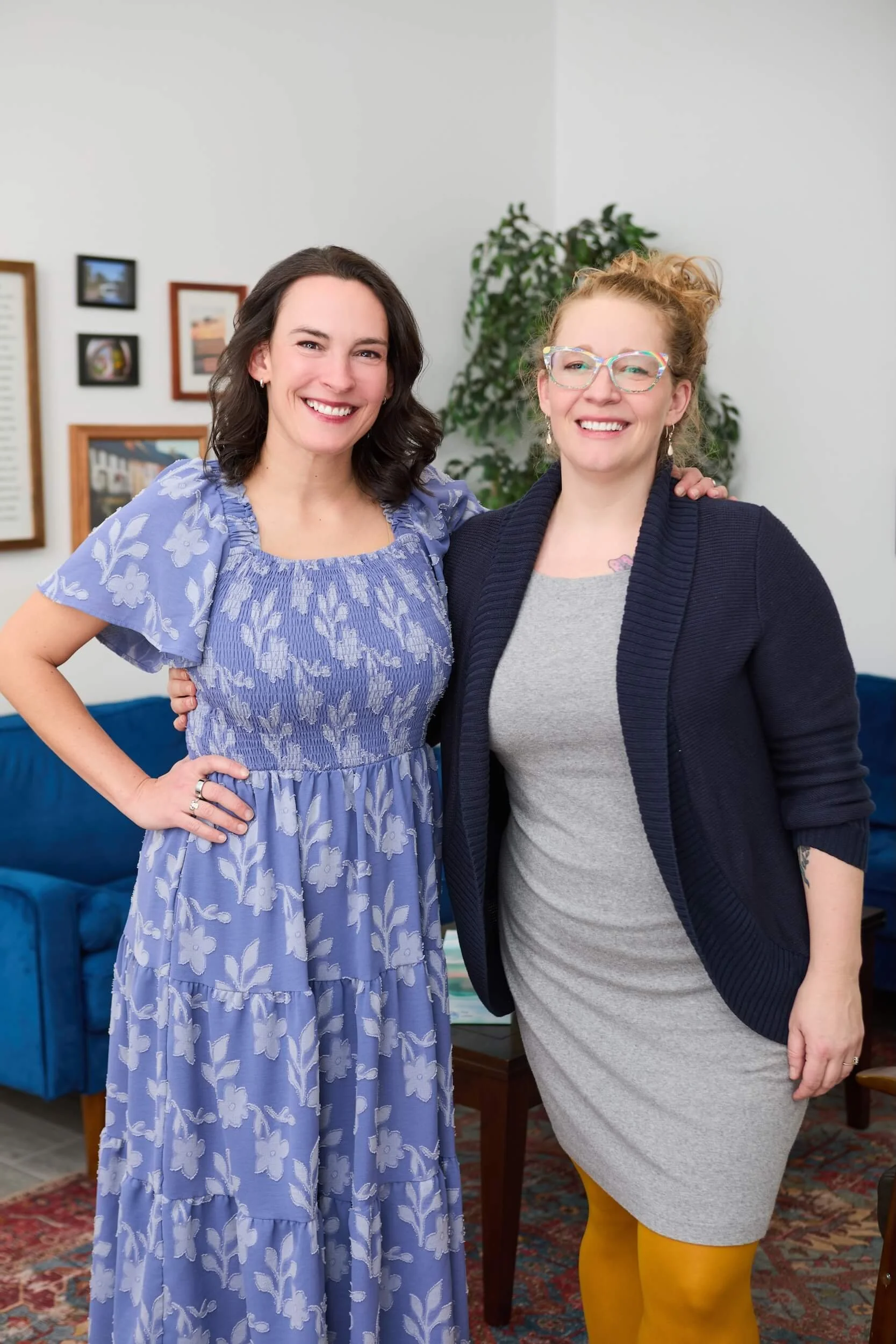 Co Founders Bridget and Brooke stand together, arm in arm, posting for a professional headshot