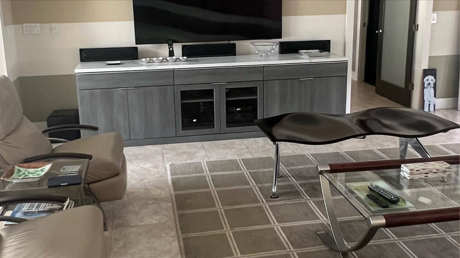 Custom entertainment center with built-in media cabinets in a Sarasota living room