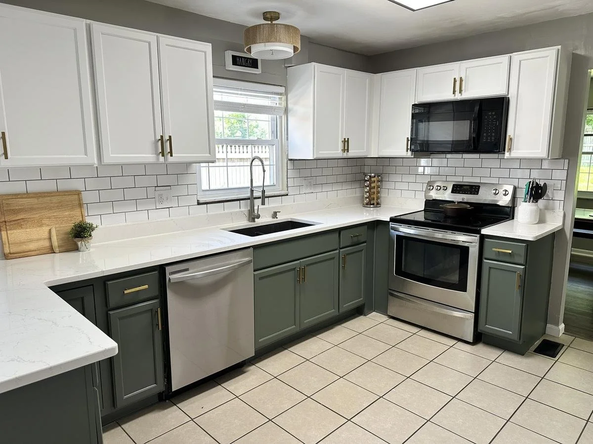 Modern two-tone kitchen with white upper cabinets and green lower cabinets refinished in Dayton, Ohio.