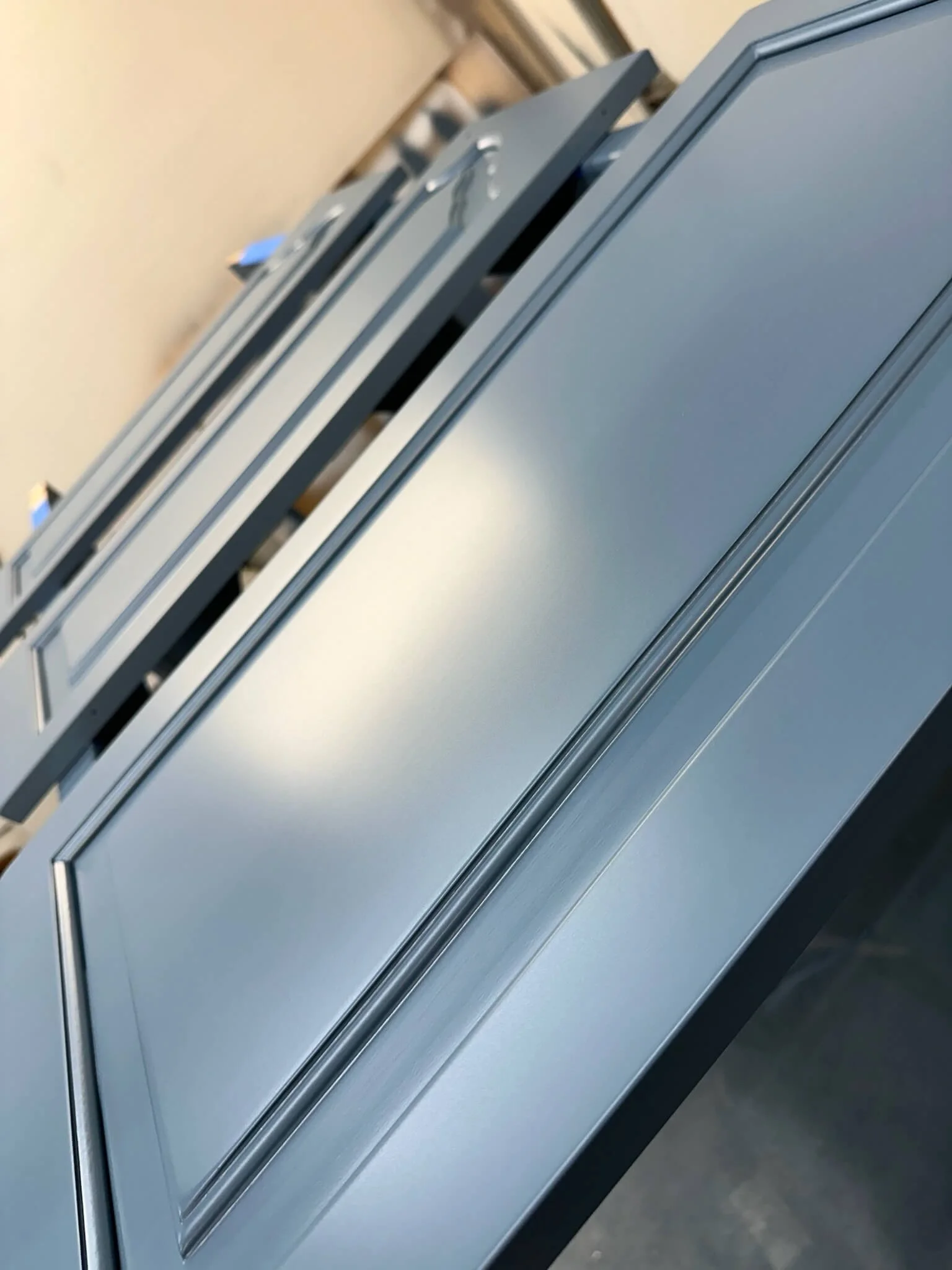 Blue cabinet doors with a factory-smooth spray finish