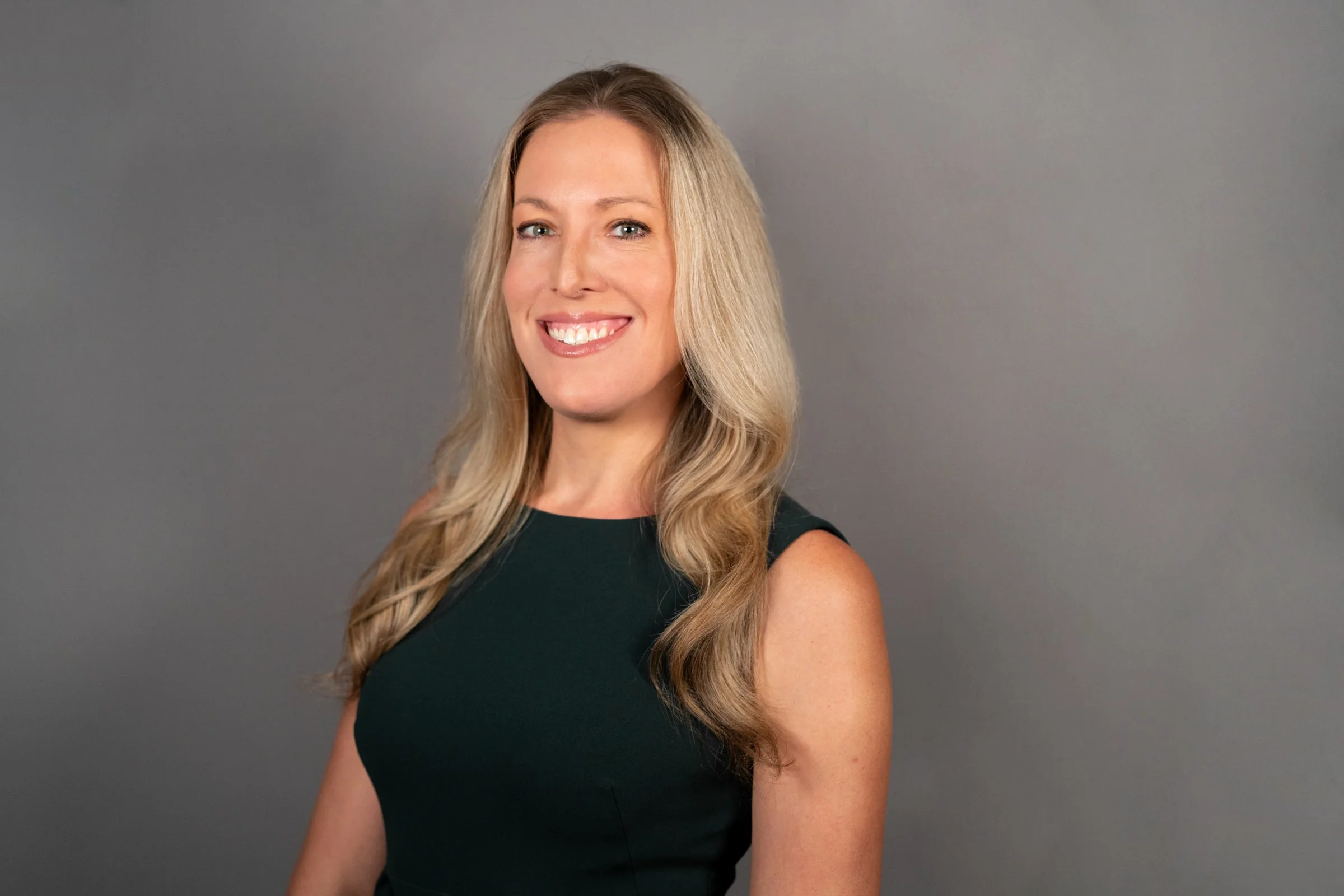 Smiling woman with long blonde hair