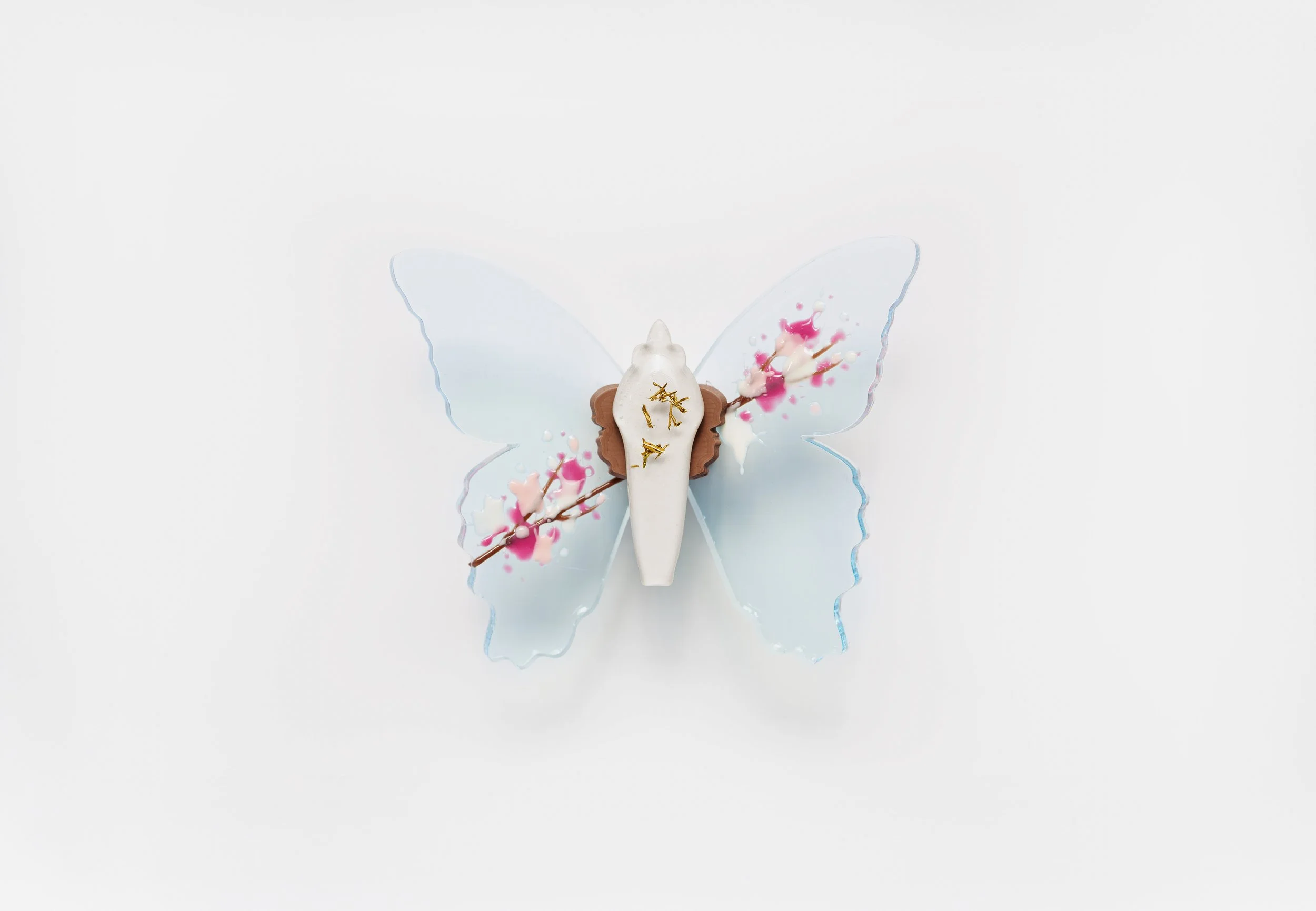 Miniature blue soft resin butterfly art featuring cherry blossoms representing the community affected by the Washington, D.C. mass shooting