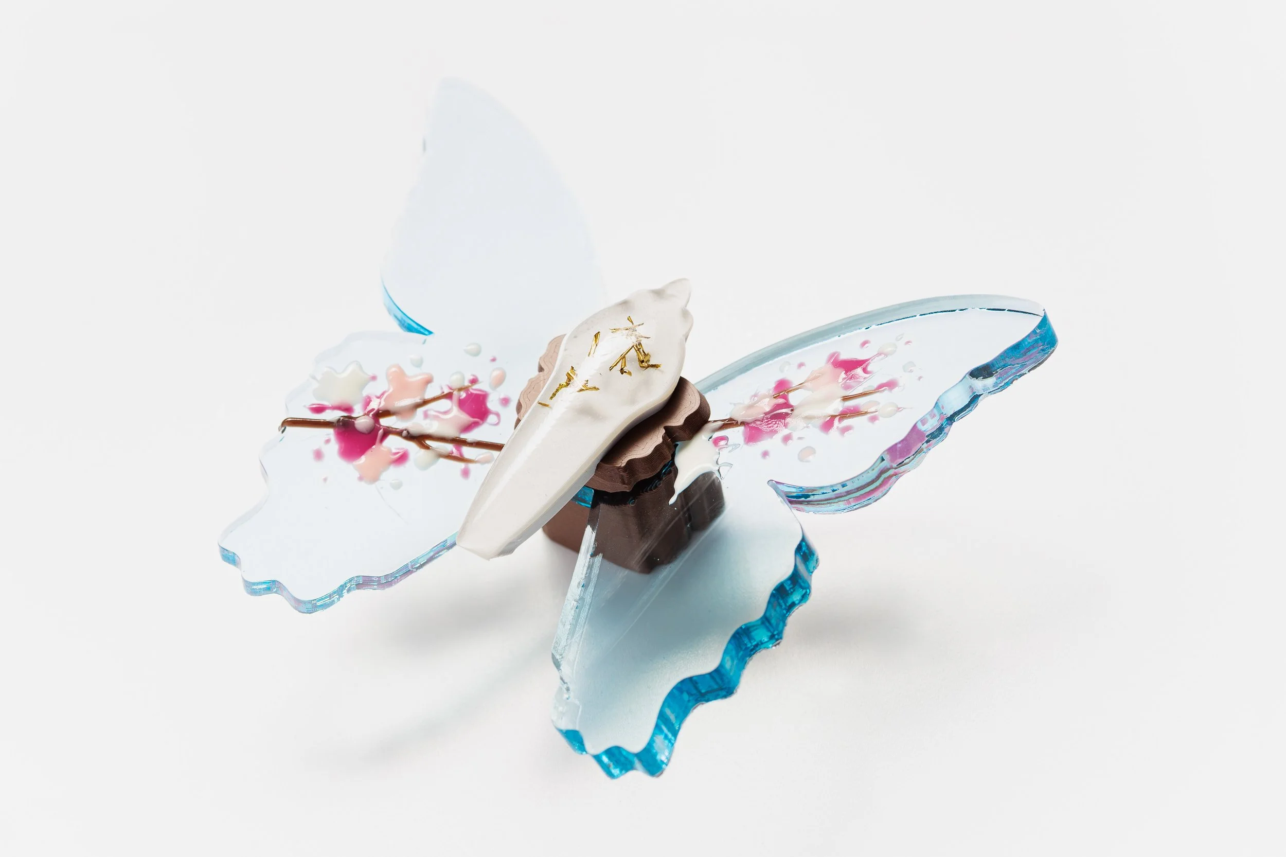 Miniature blue soft resin butterfly art featuring cherry blossoms representing the community affected by the Washington, D.C. mass shooting