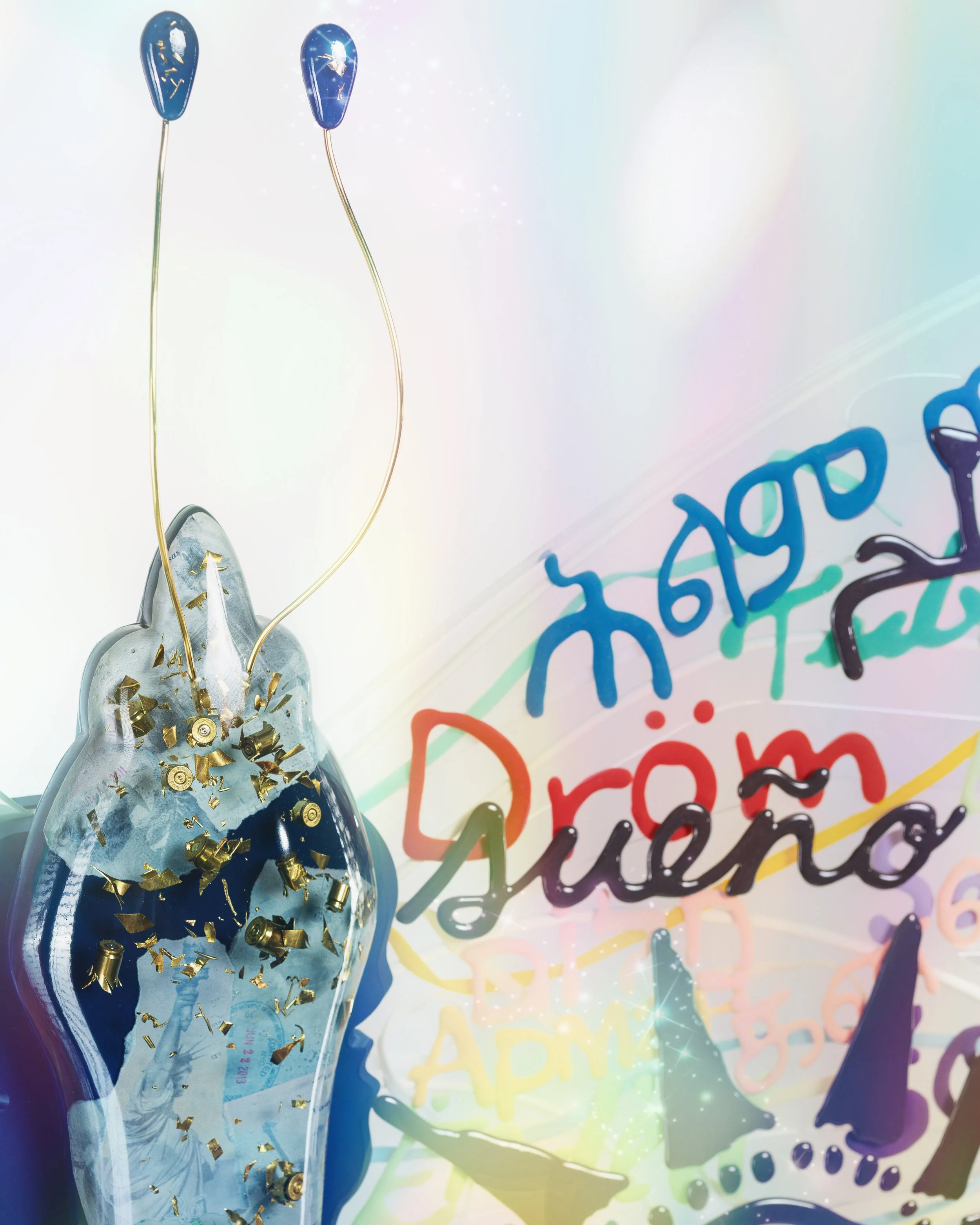 Resin butterfly sculpture with shredded bullet casings in the thorax and the word "Dream" in many different languages embedded in the wings.