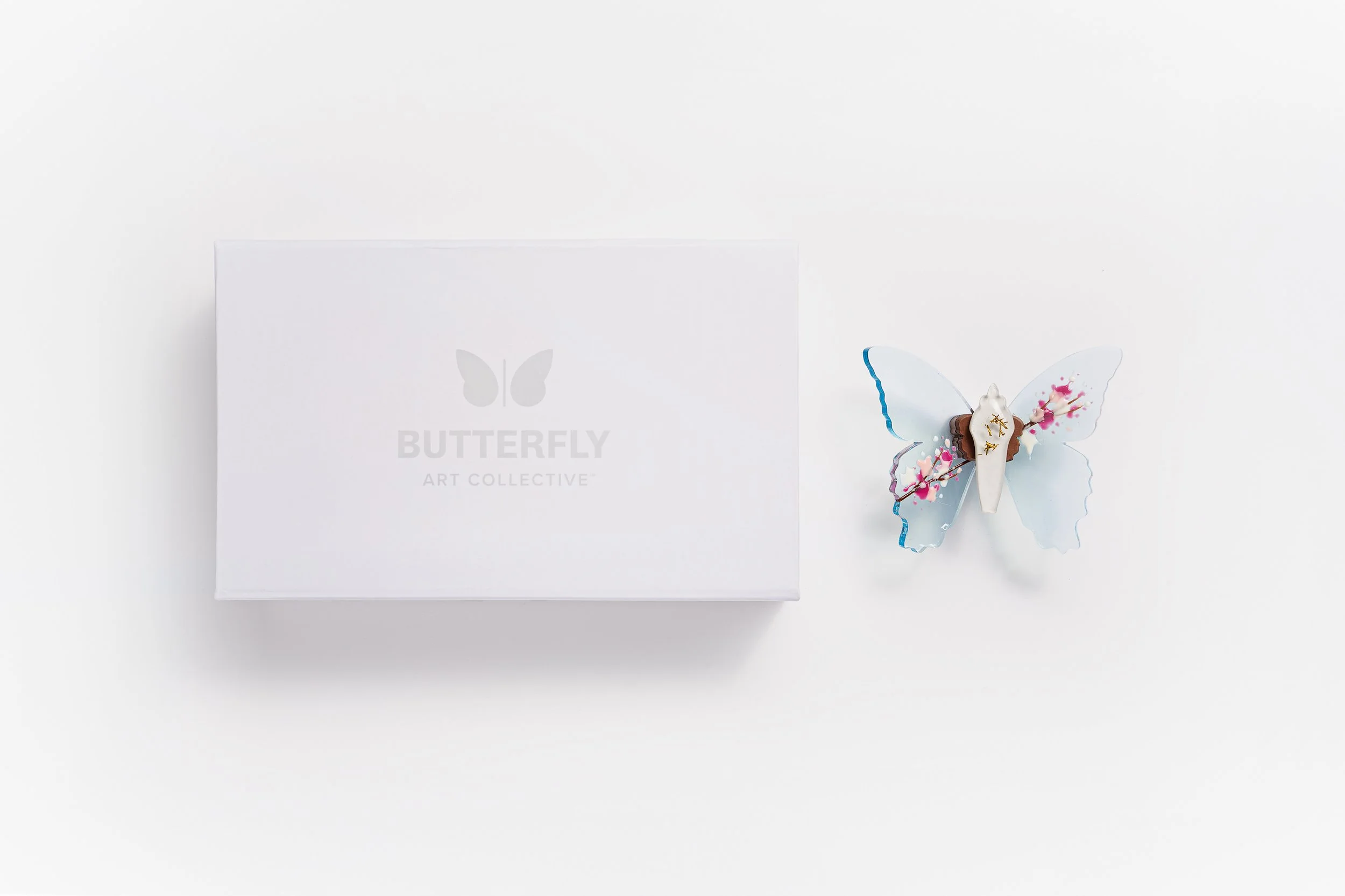 Miniature blue soft resin butterfly art featuring cherry blossoms representing the community affected by the Washington, D.C. mass shooting